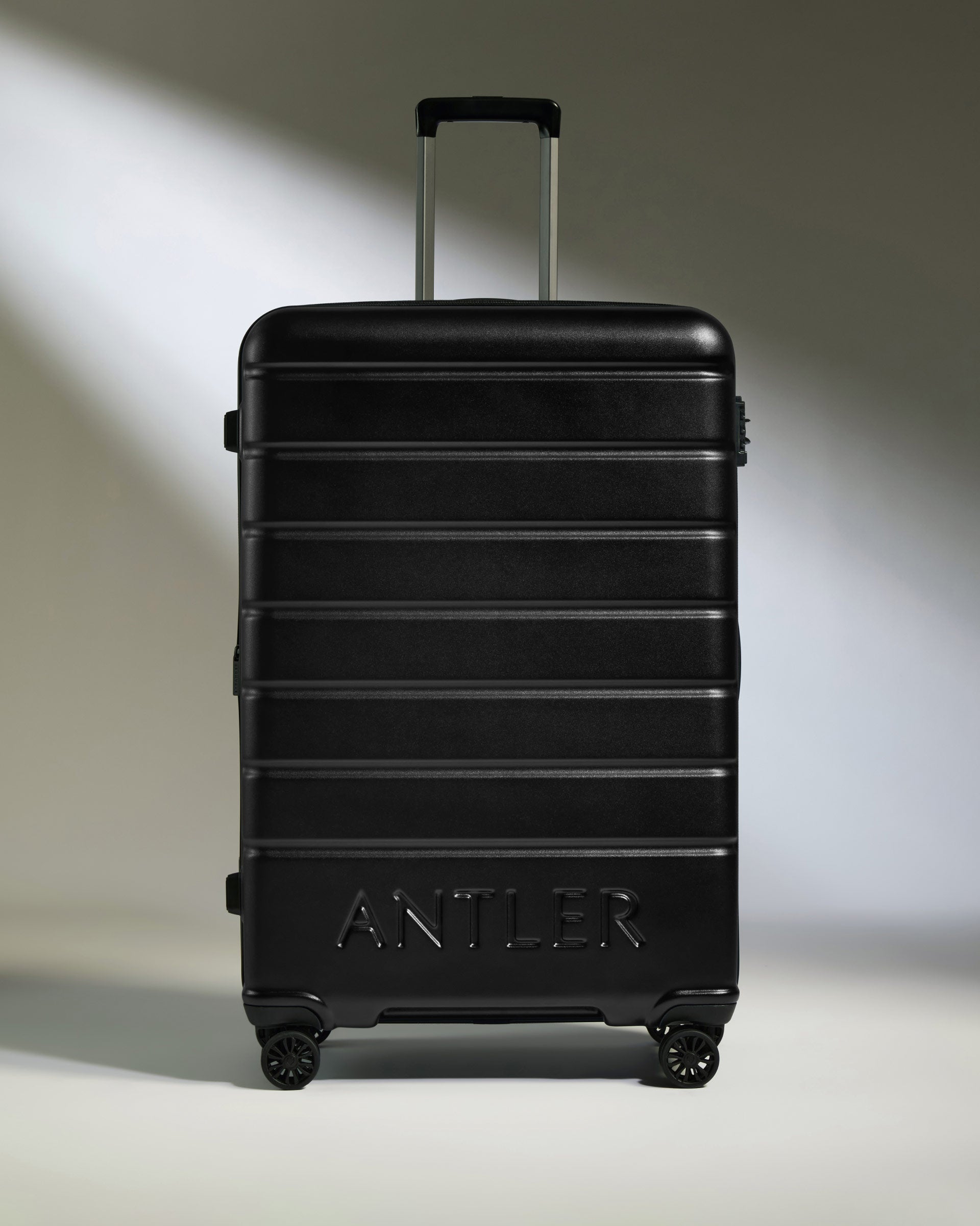 a black suitcase with handles