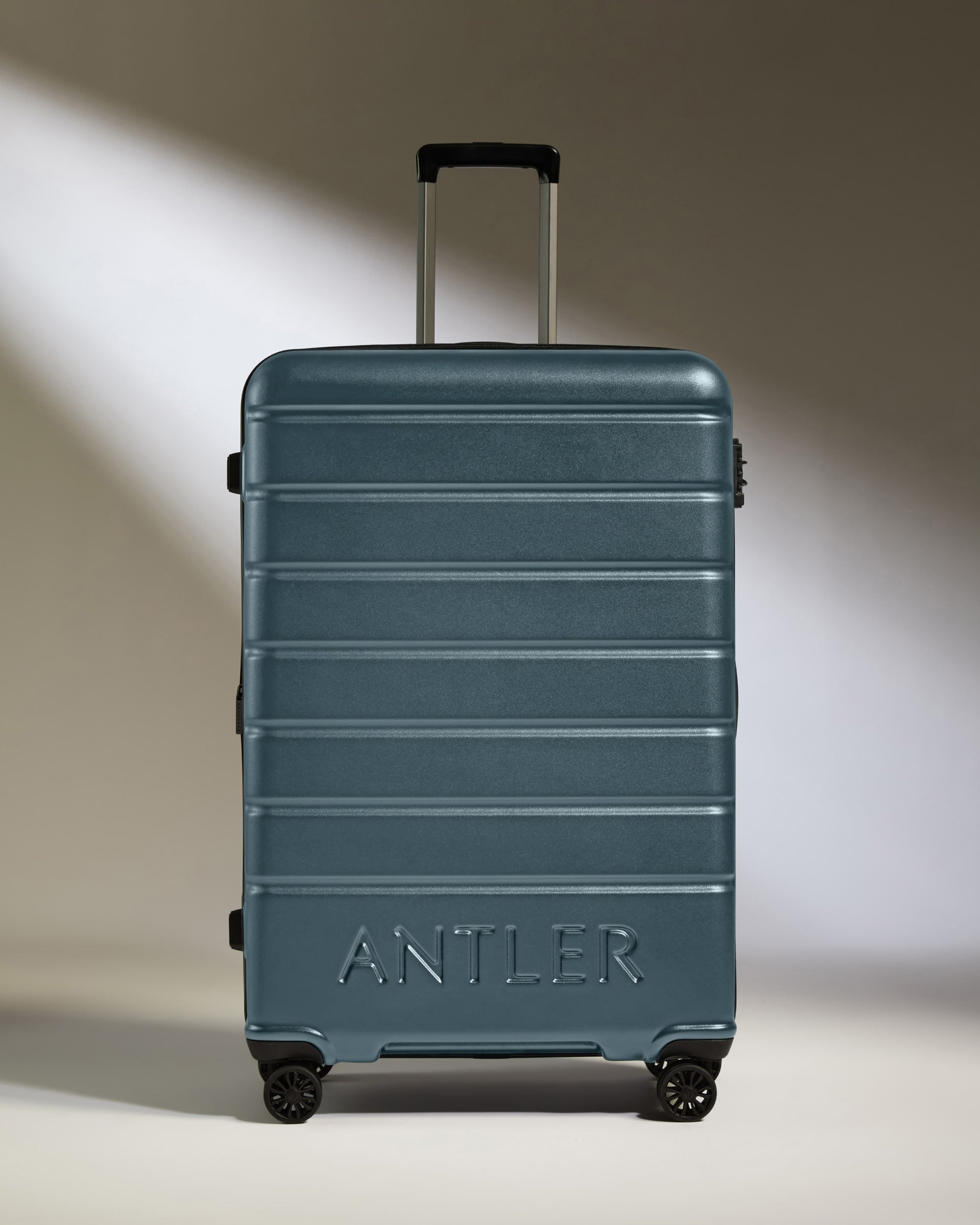 a blue suitcase with wheels