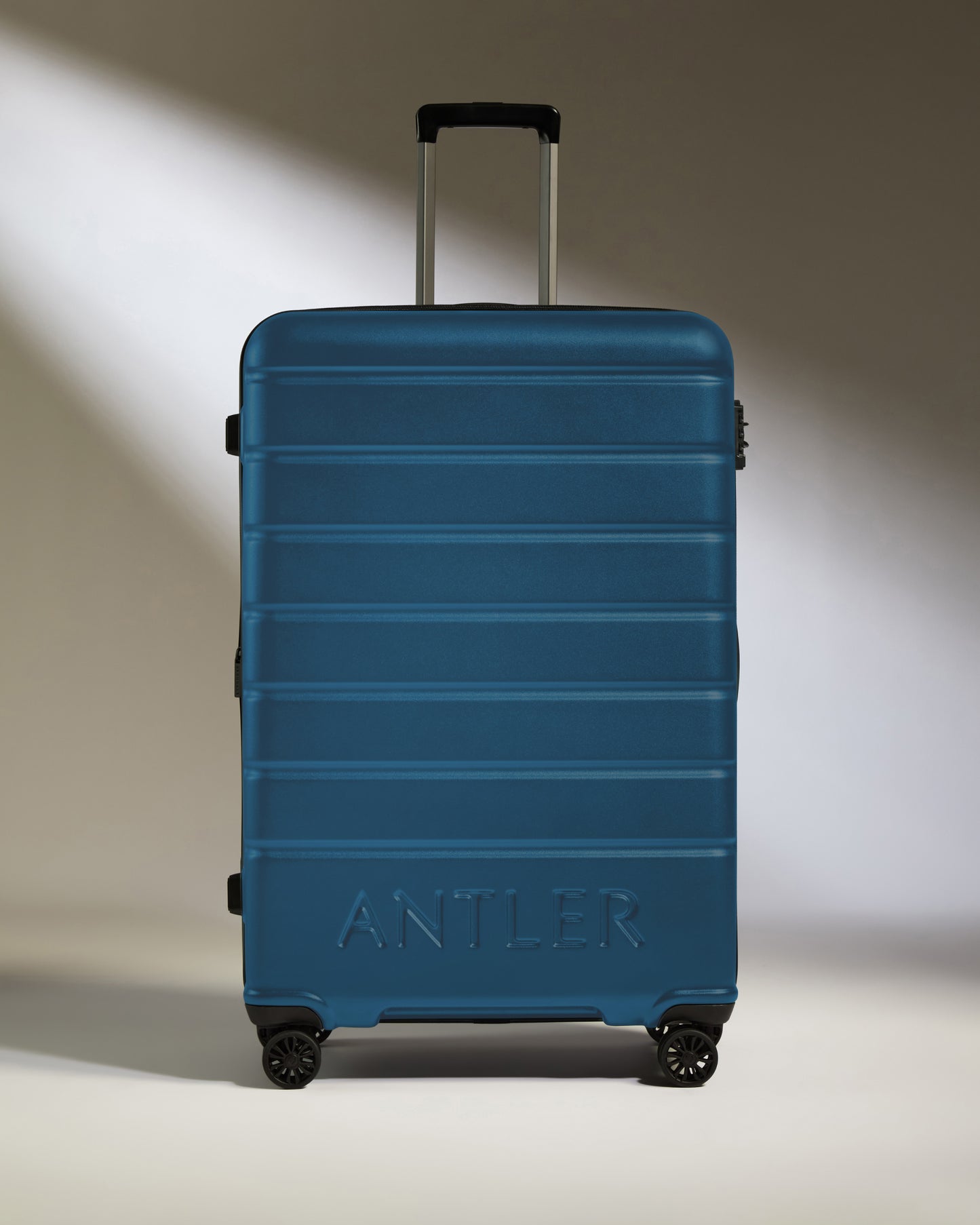 Large Suitcase in Bold Blue - Logo