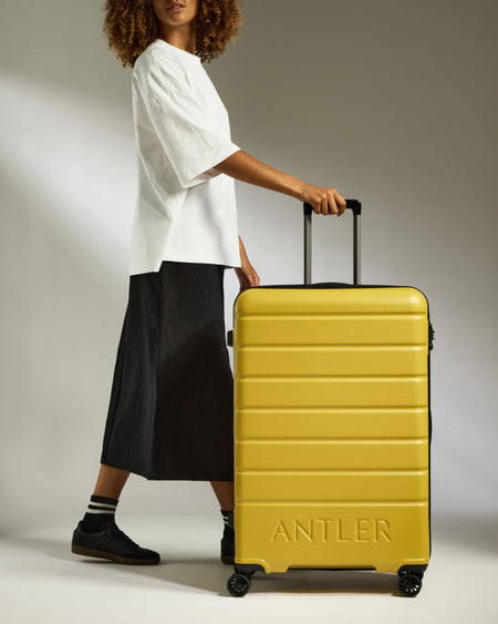 Large Suitcase in Mustard Yellow - Logo