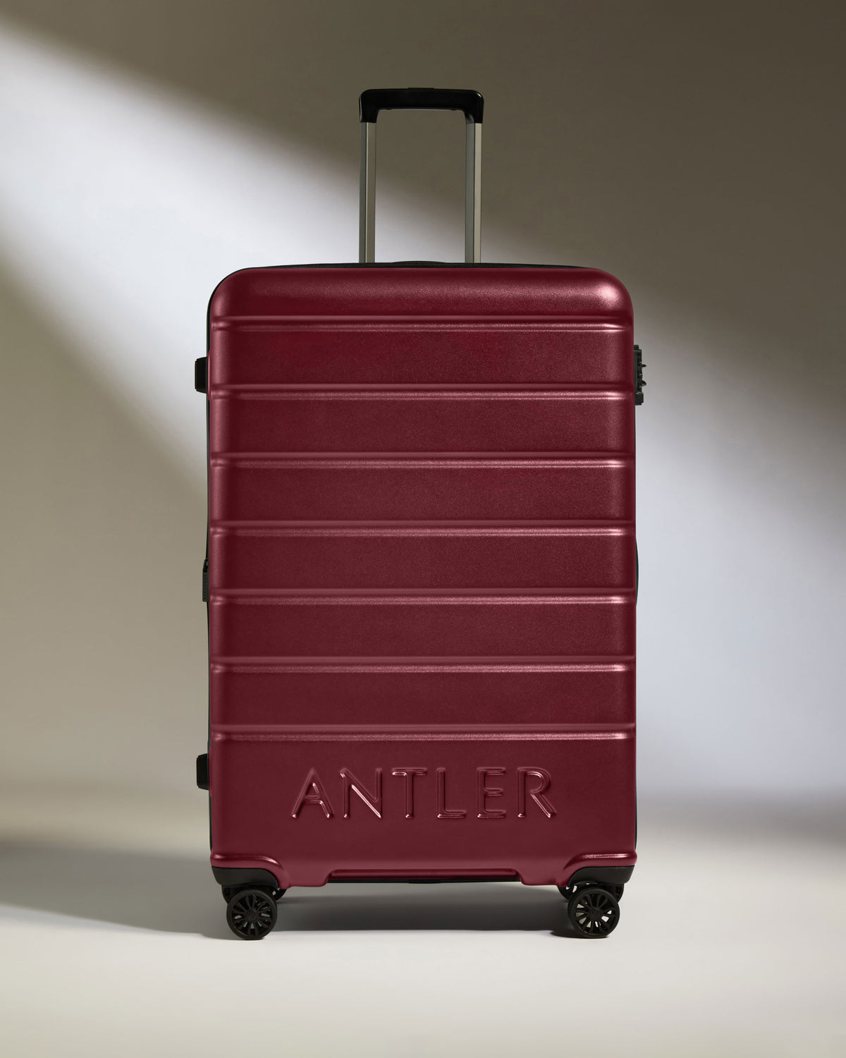 a red suitcase with handle