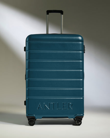 Large Suitcase in Soft Blue - Logo