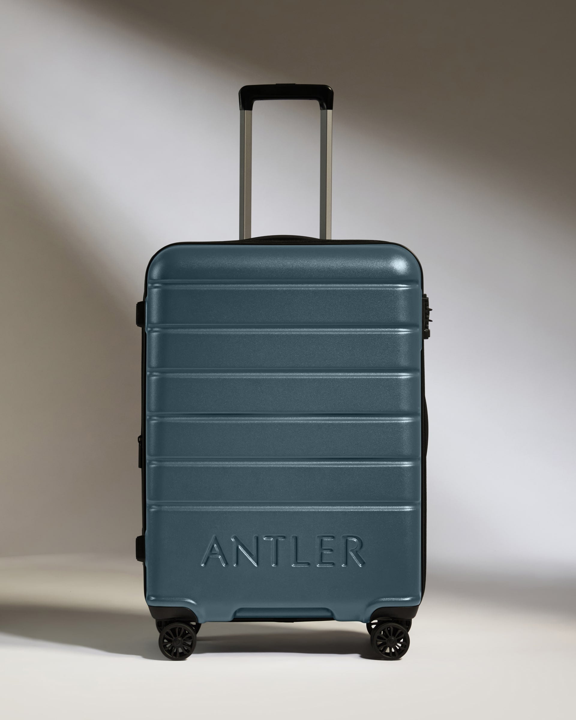 a blue suitcase with wheels