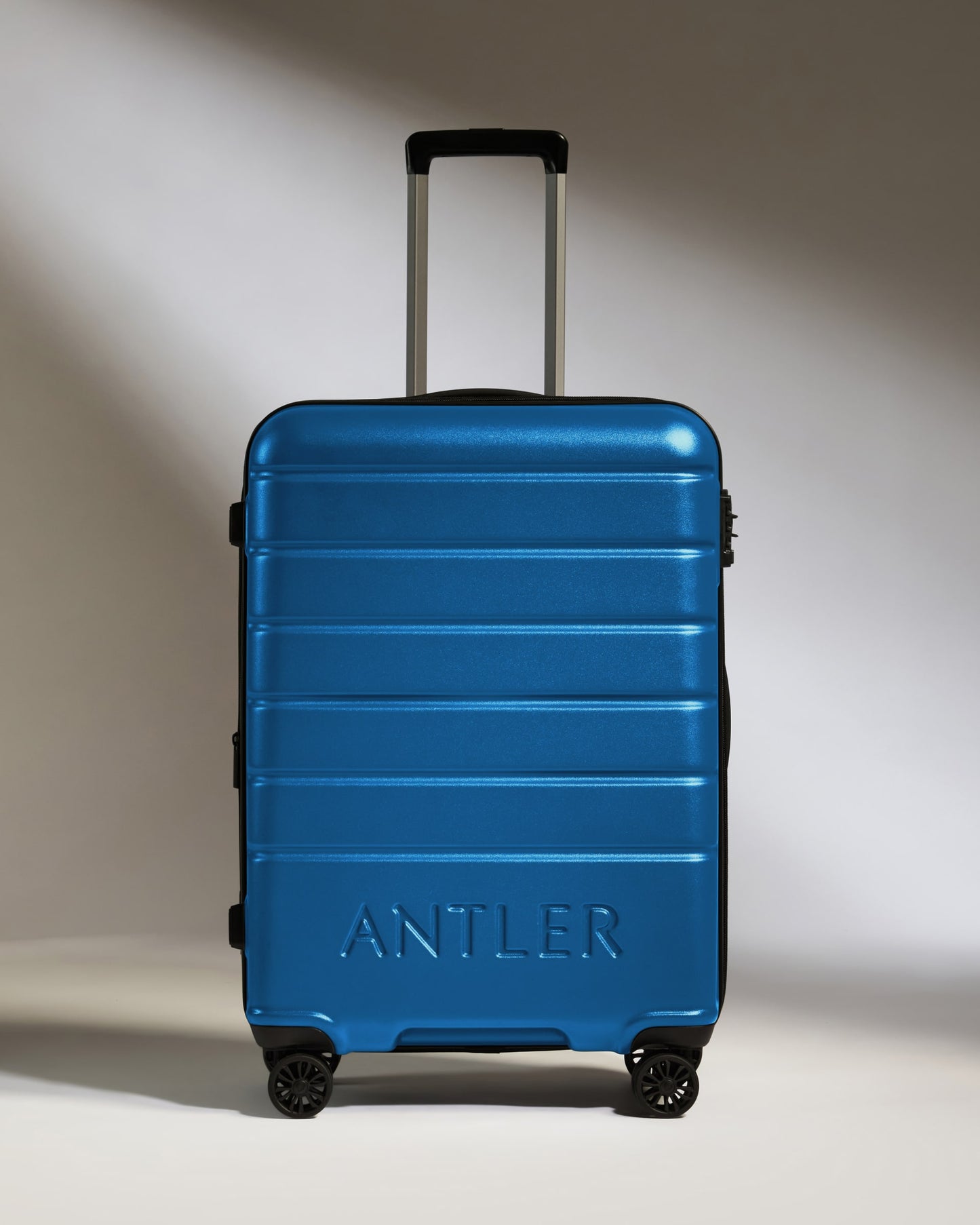 Medium Suitcase in Bold Blue - Logo