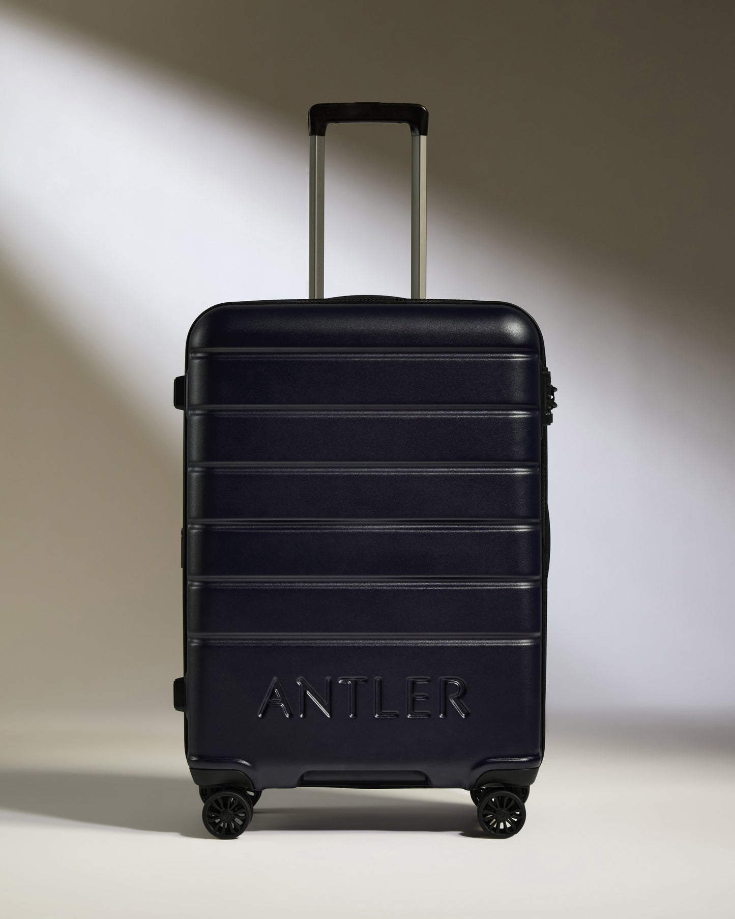 Medium Suitcase in Dark Purple - Logo