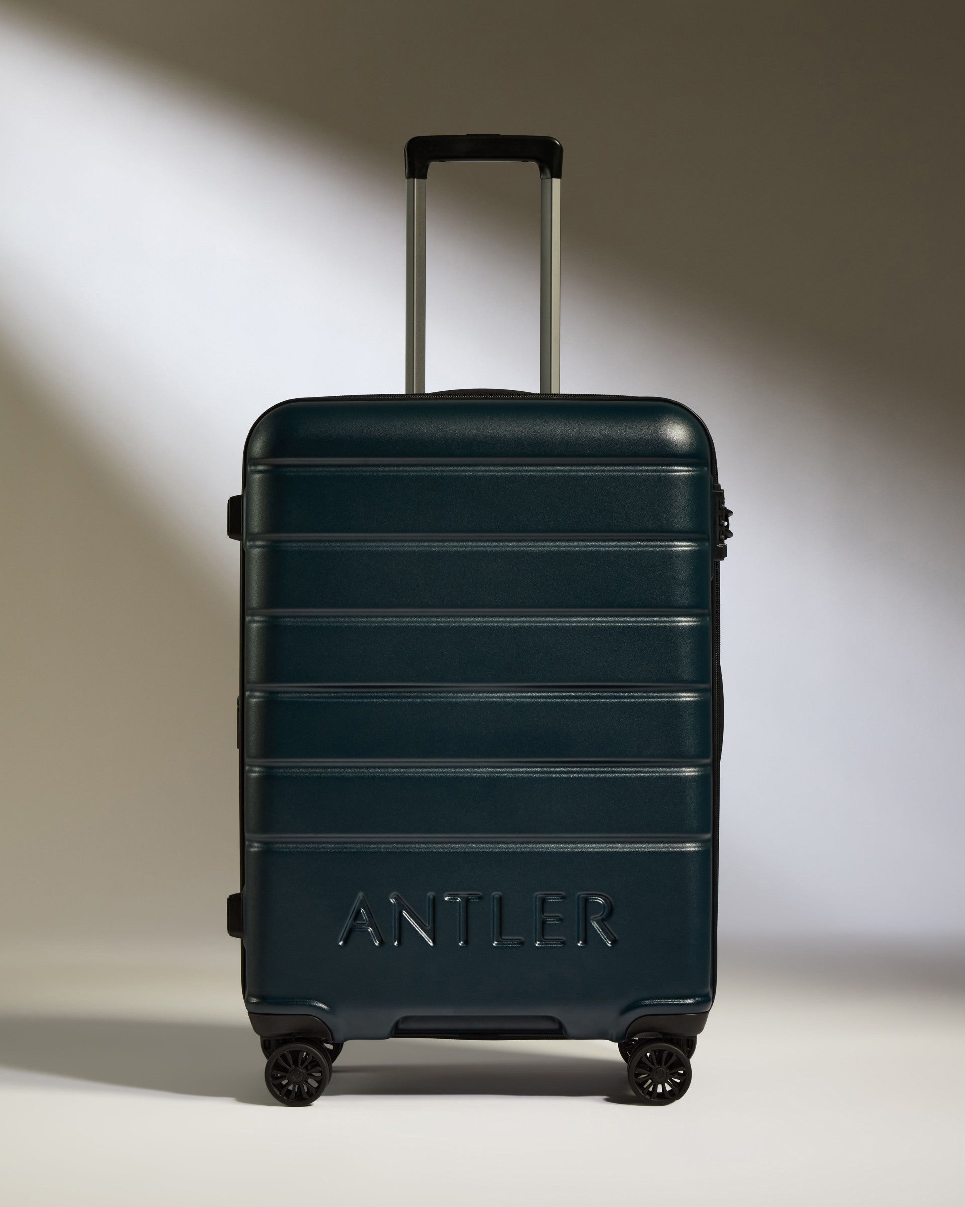 a suitcase with wheels and handle