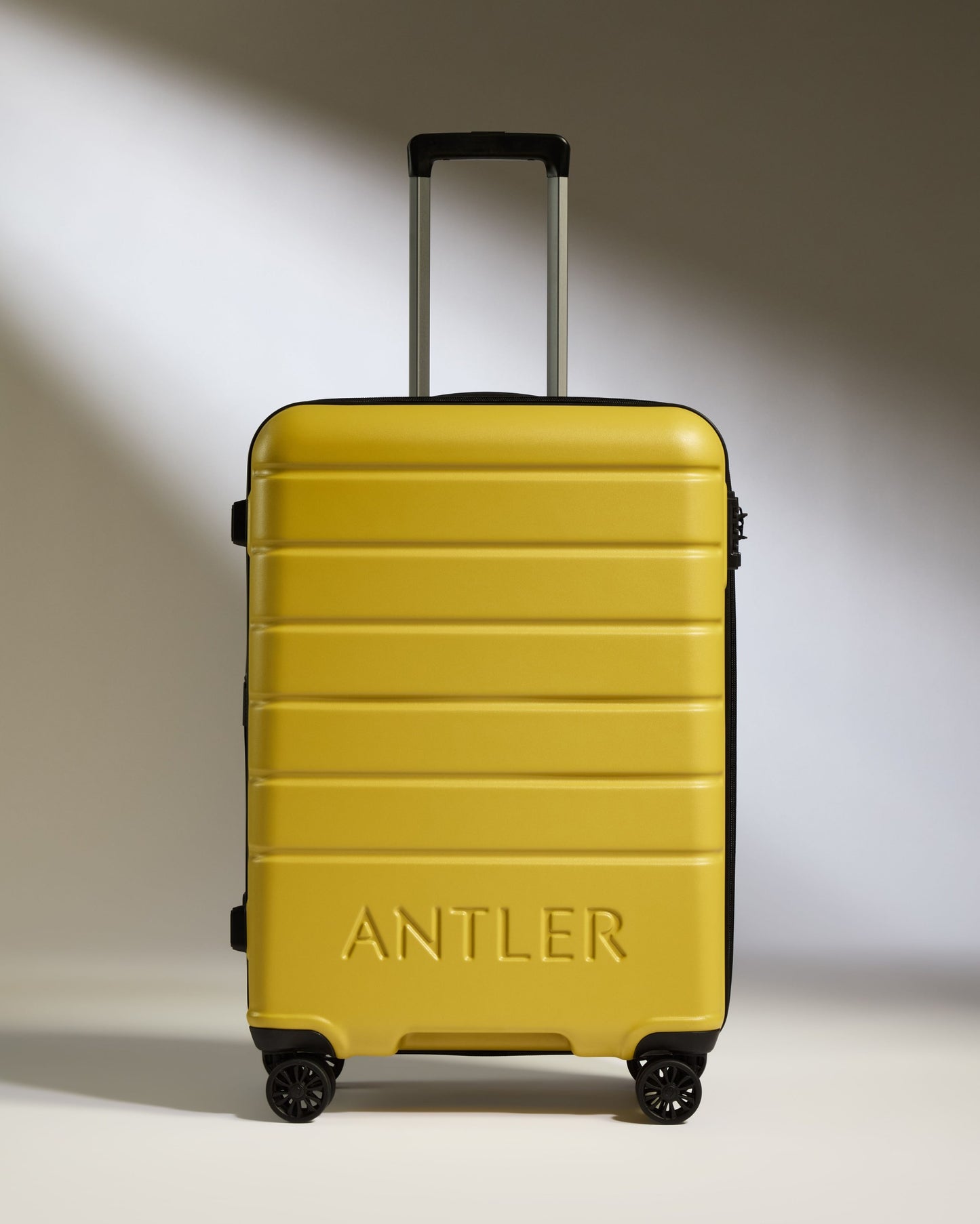 Medium Suitcase in Mustard Yellow - Logo