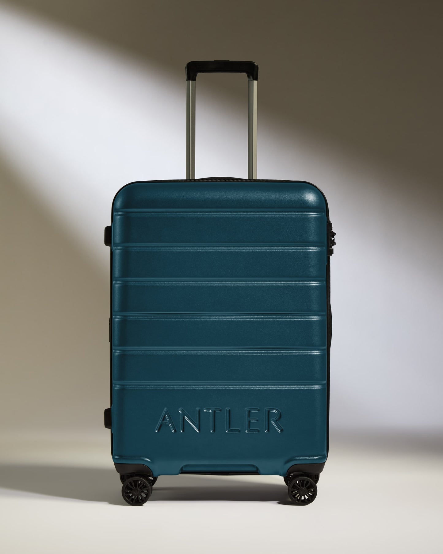 Medium Suitcase in Soft Blue - Logo