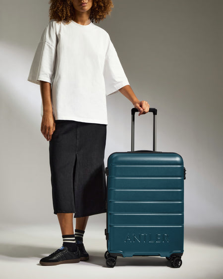 Medium Suitcase in Soft Blue - Logo