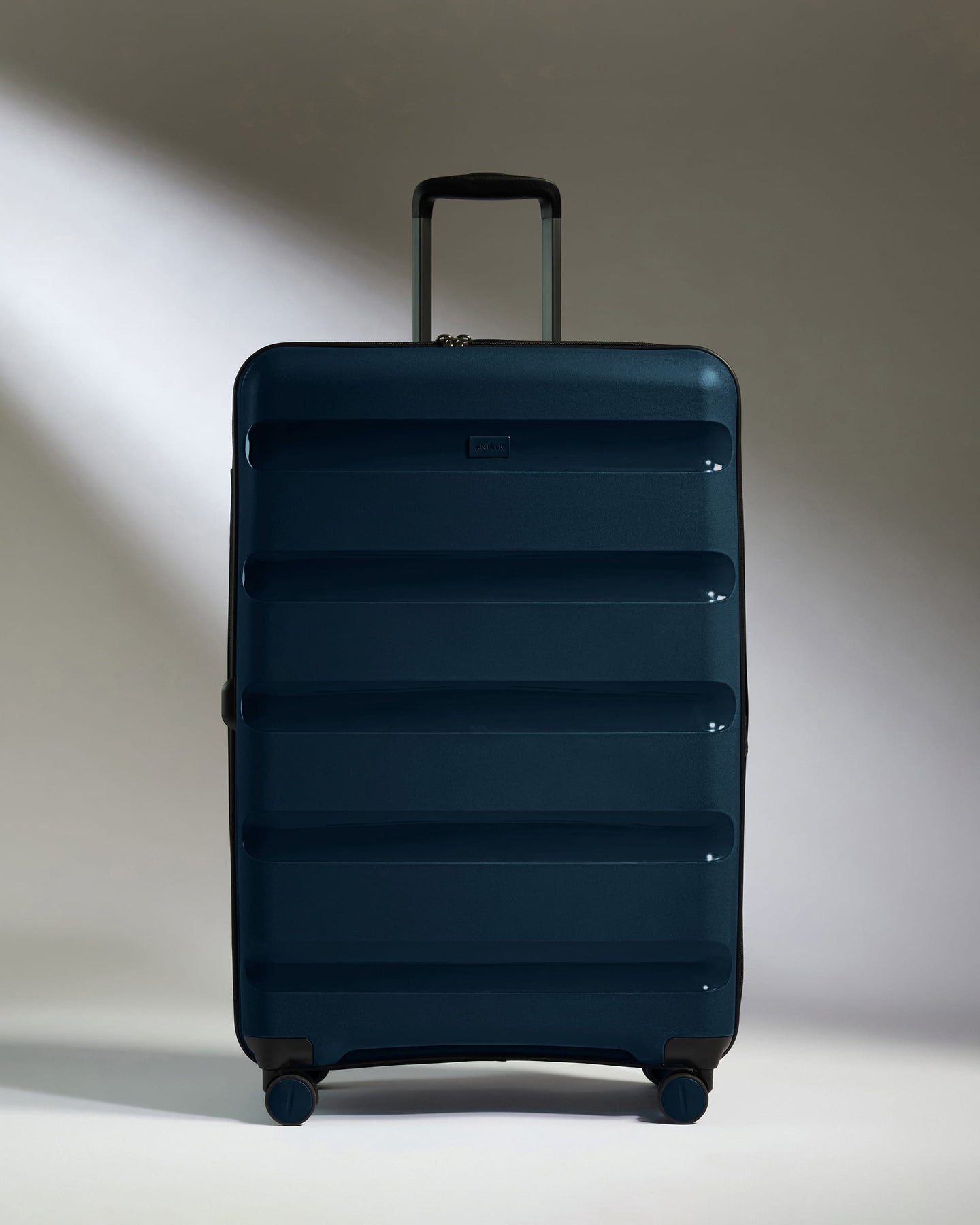 Large Suitcase in Midnight Blue - Logo Stripe