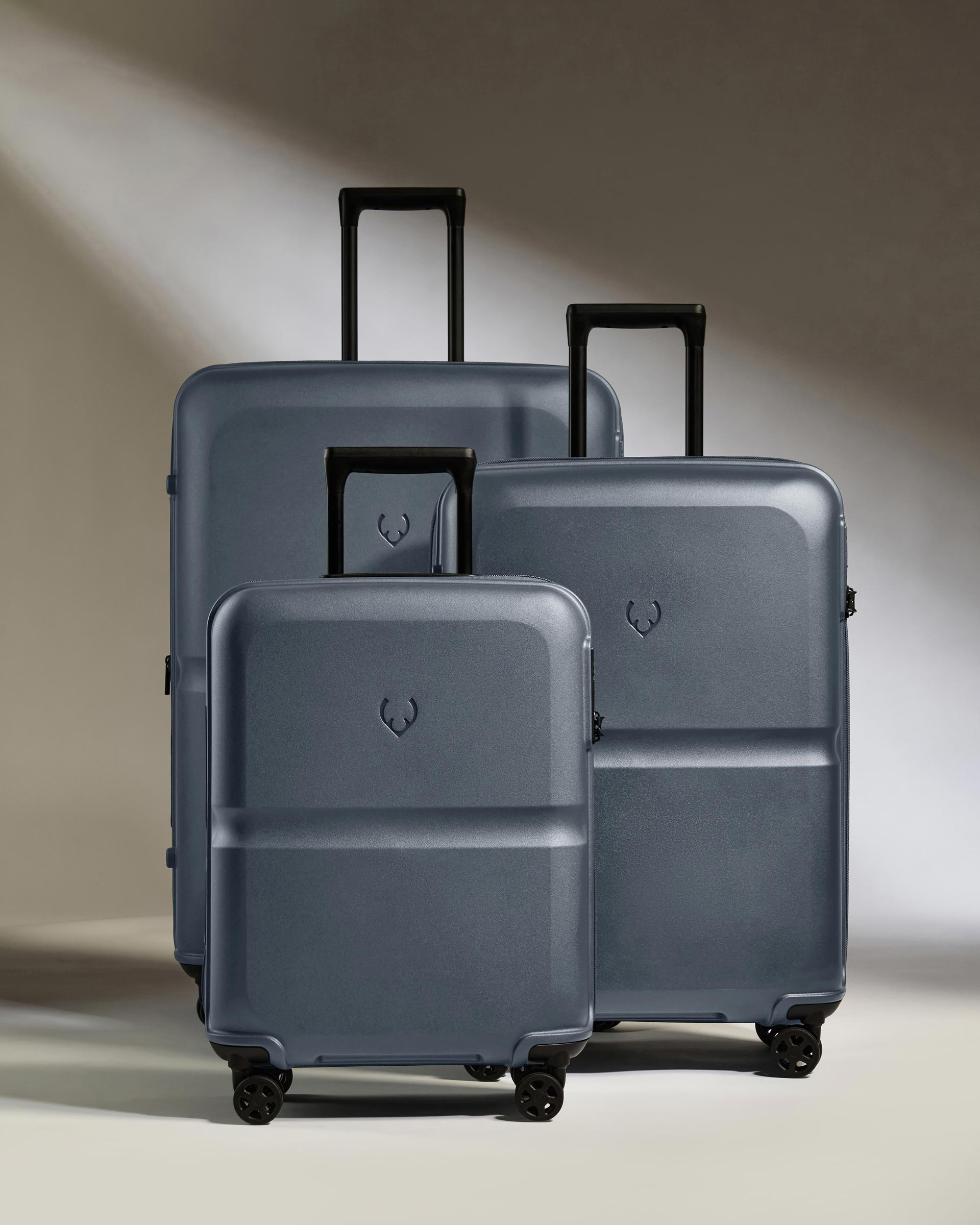 a group of luggage on wheels