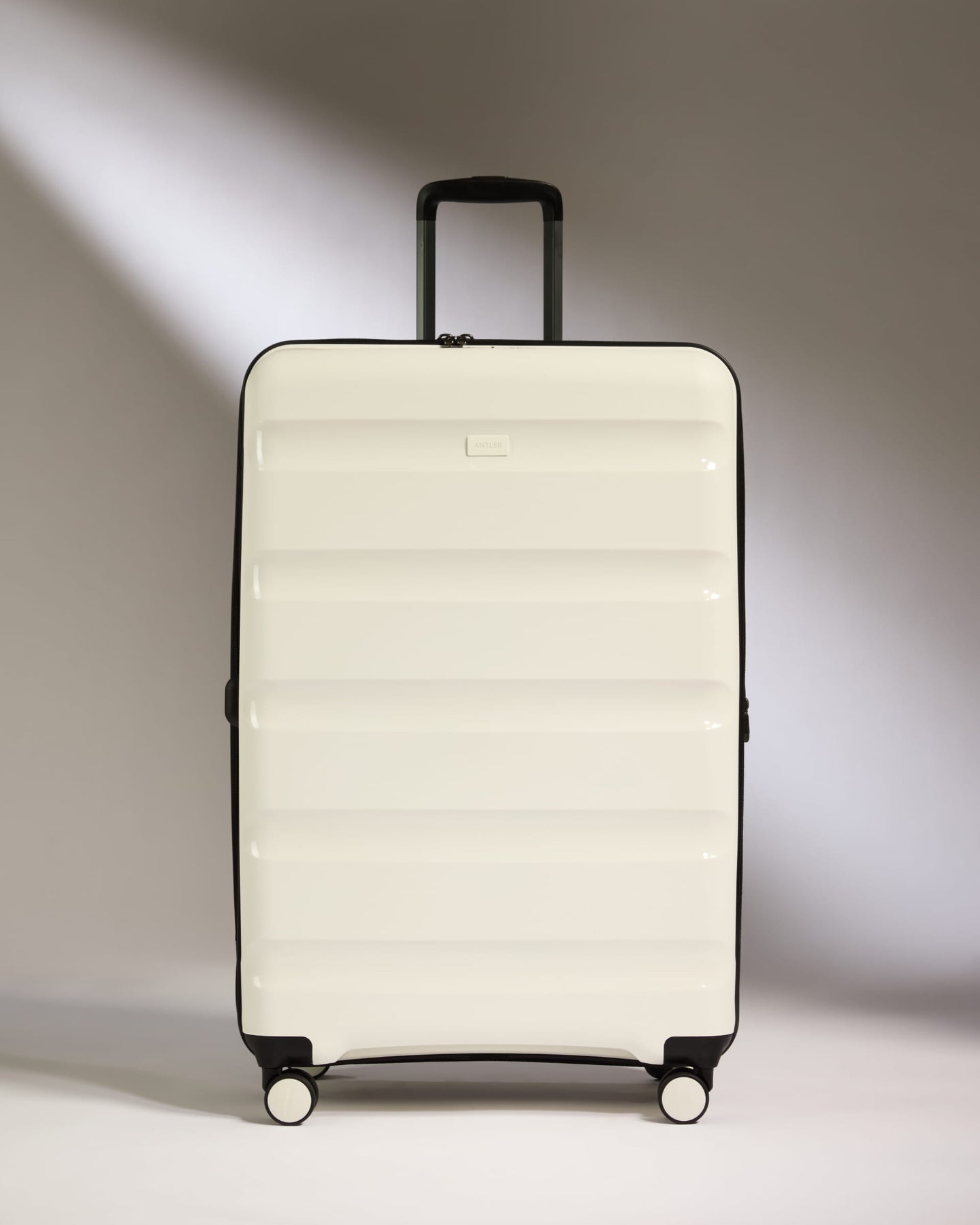 Large Suitcase in White - Logo Stripe