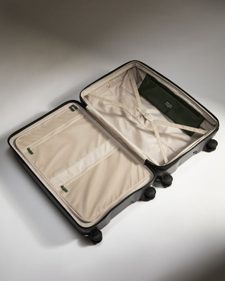 Large Suitcase in Black - Icon Stripe