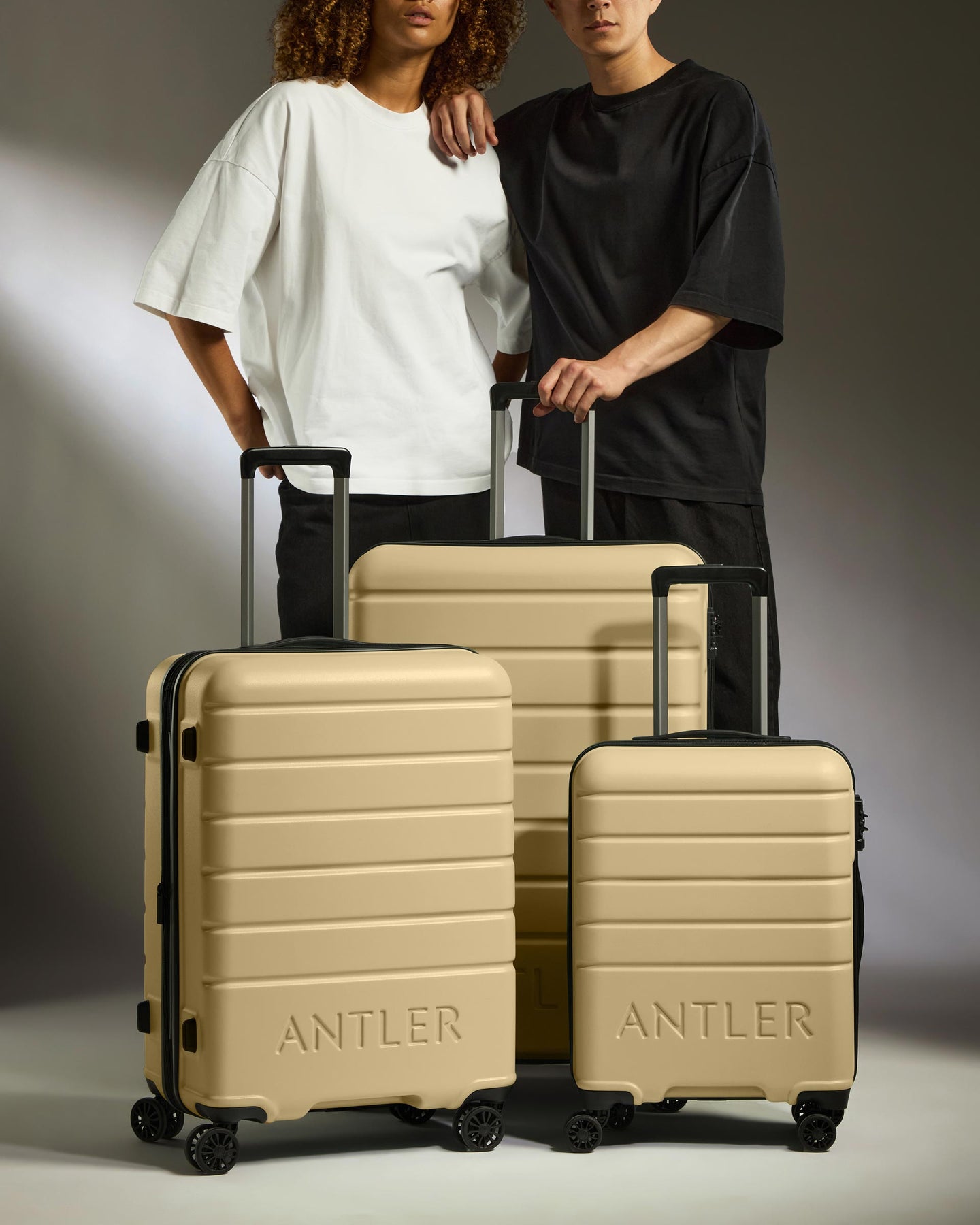 Suitcase Set in Dark Sand - Logo
