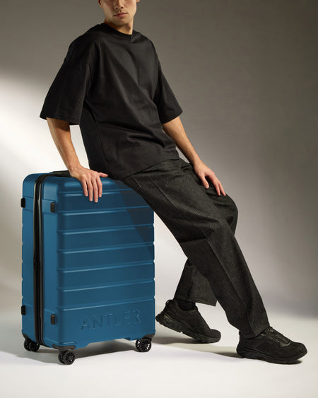 Large Suitcase in Bold Blue - Logo
