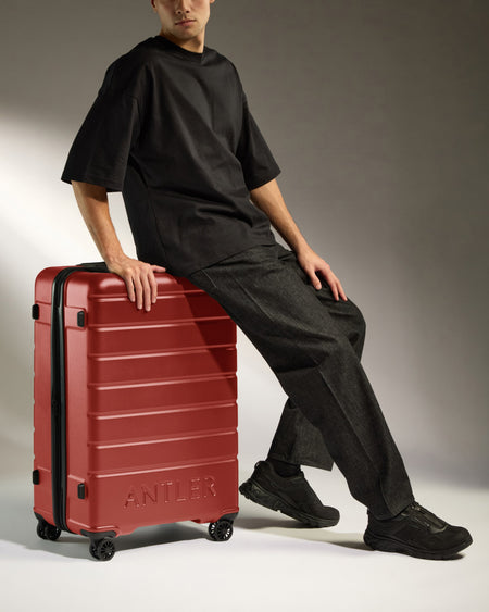 Large Suitcase in Red Orange - Logo
