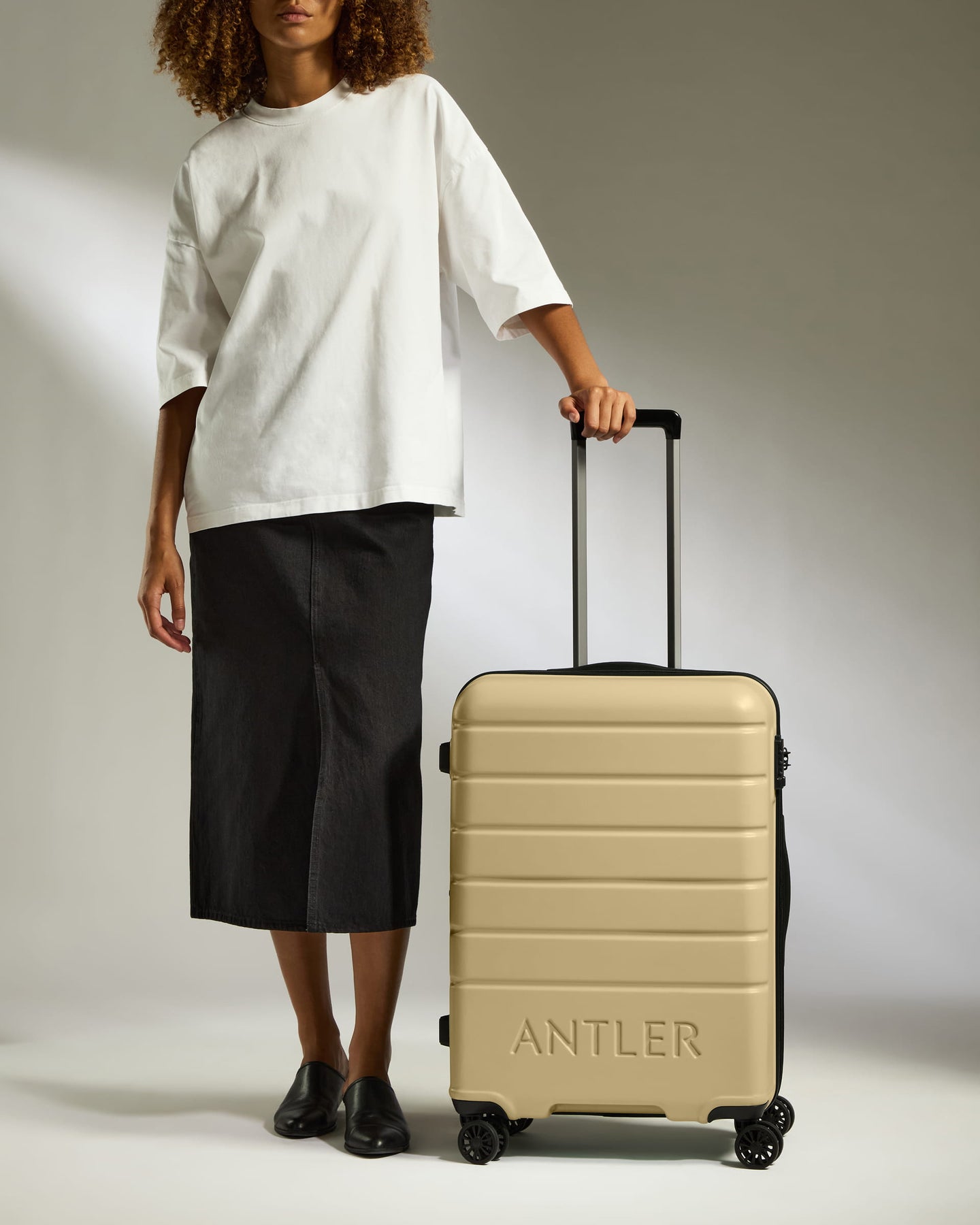 Medium Suitcase in Dark Sand - Logo