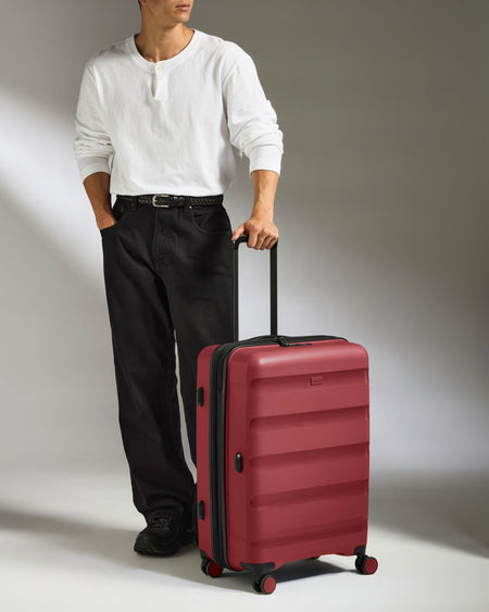 Medium Suitcase in Soft Red - Logo Stripe