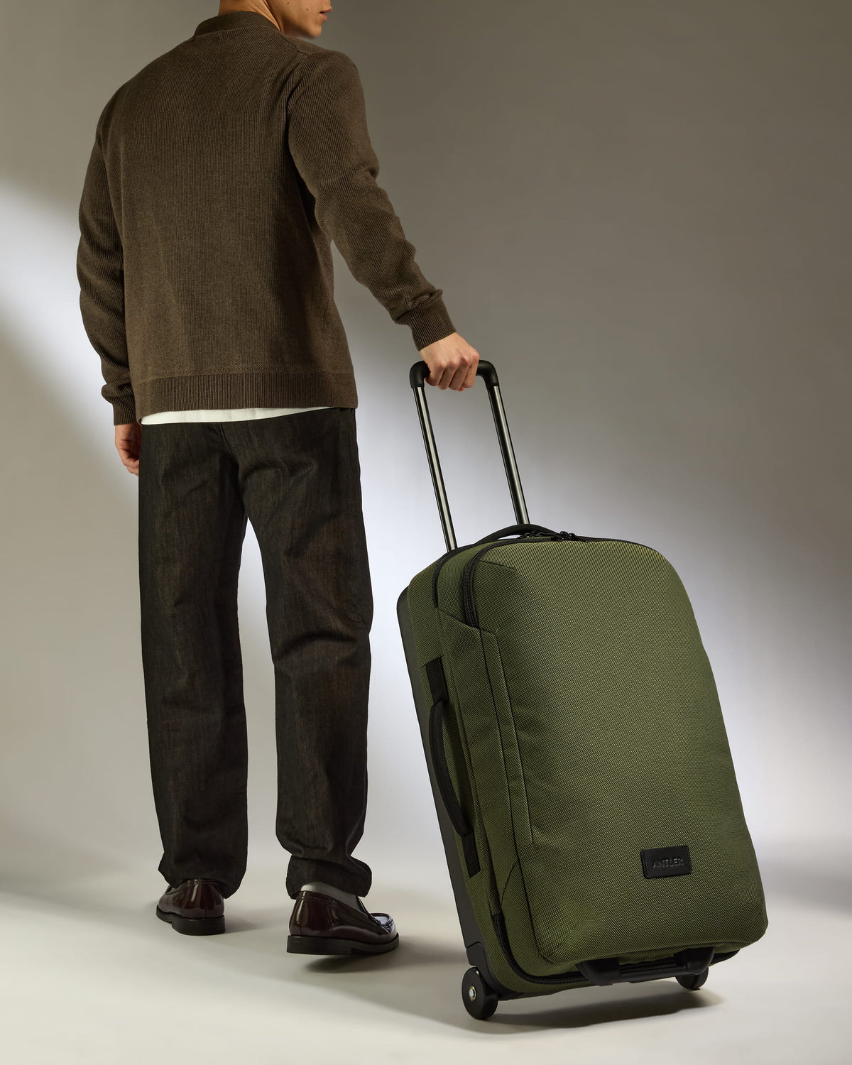 a man holding a suitcase