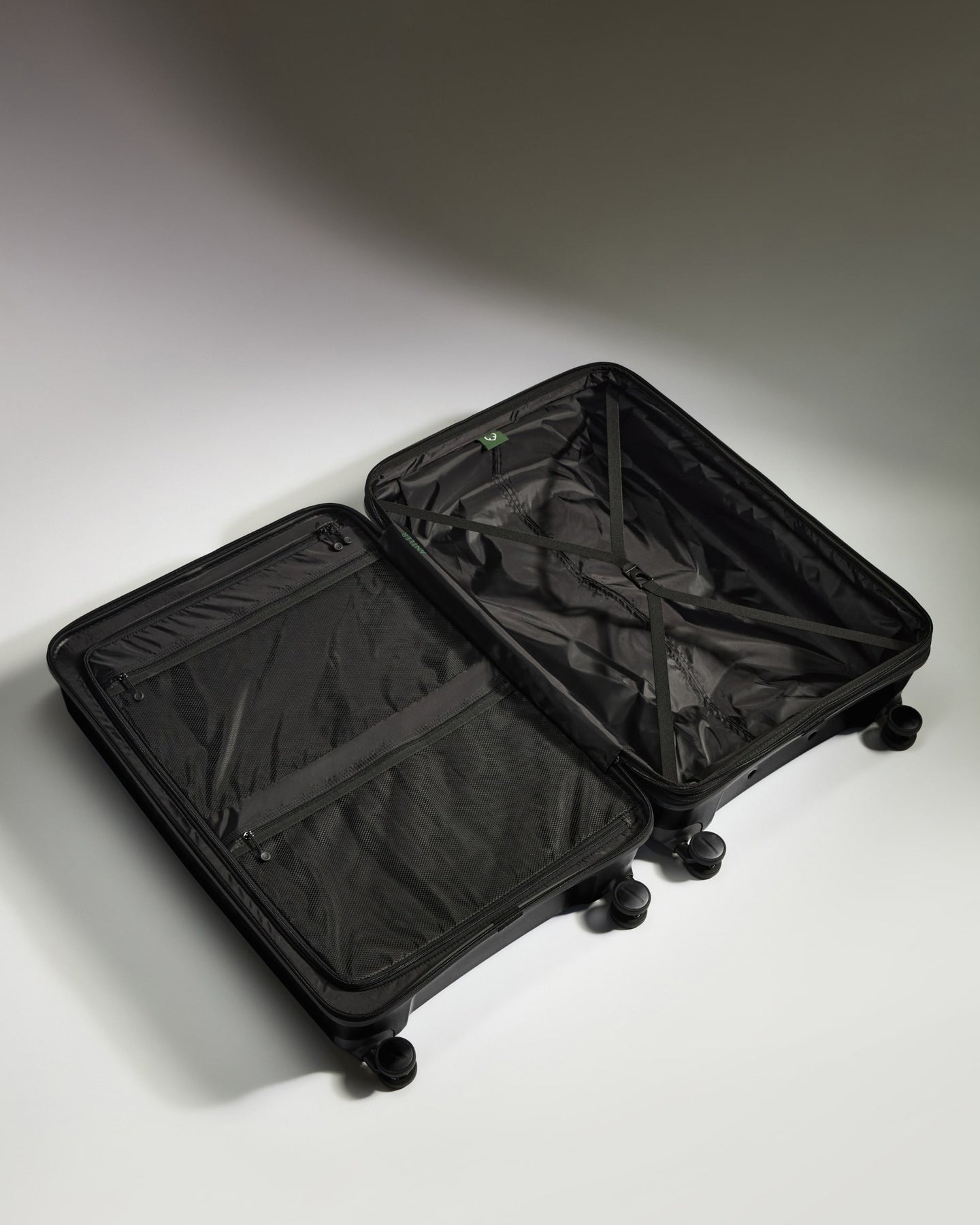 Large Suitcase in Black - Logo Stripe