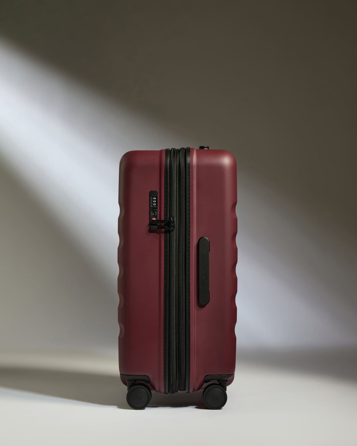 Medium Suitcase in Cedar Red - Icon Stripe