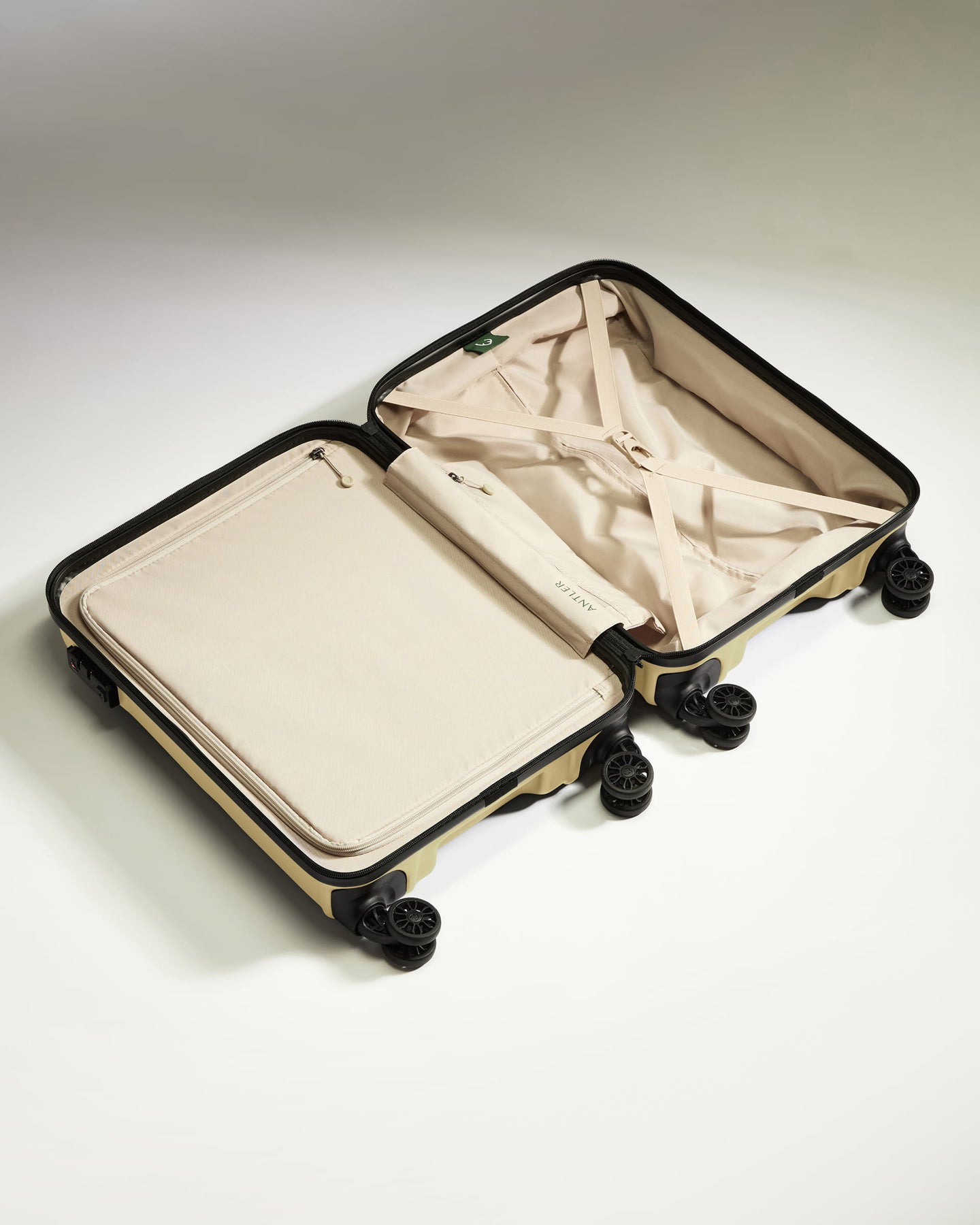Cabin Suitcase in Dark Sand - Logo