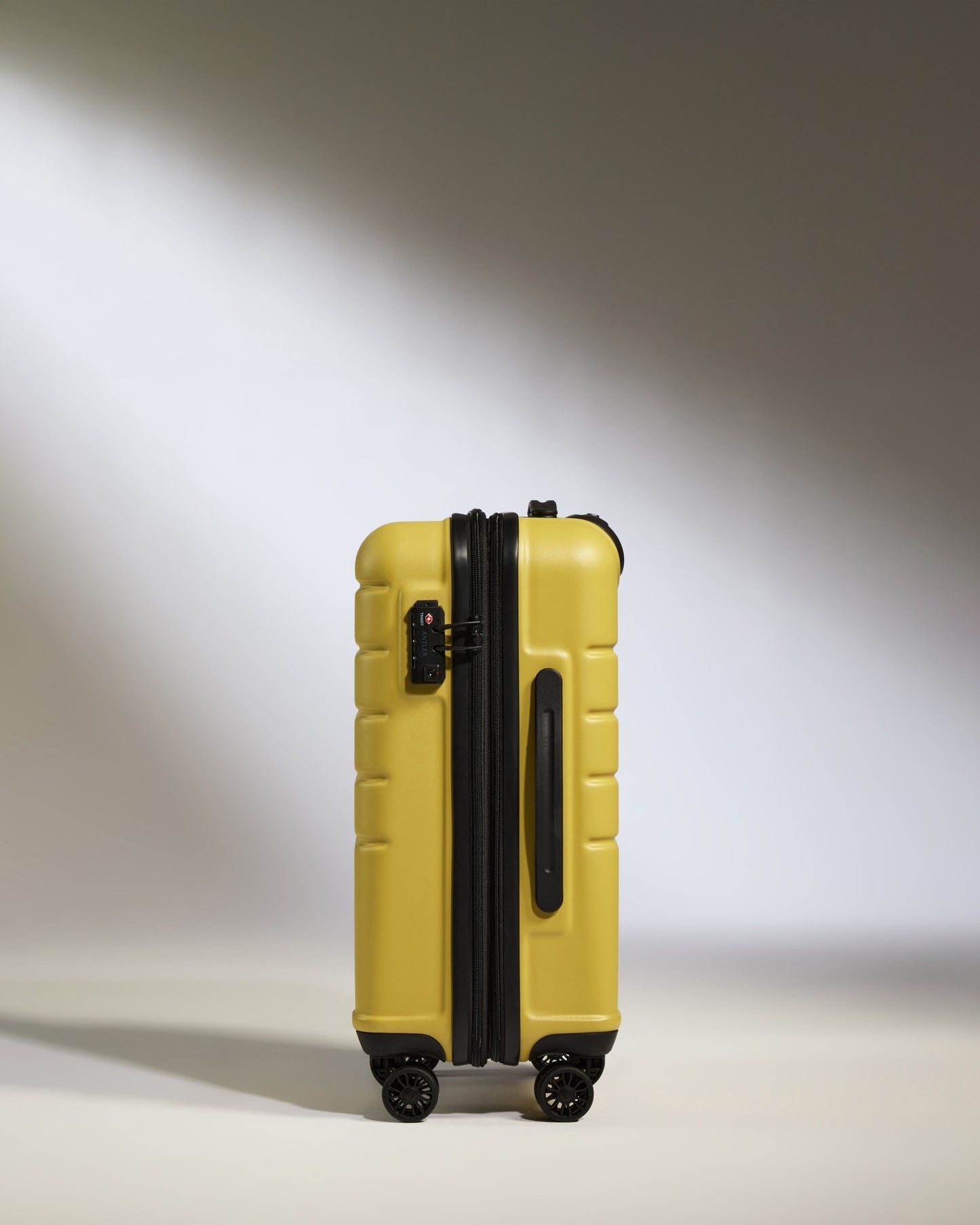 Cabin Suitcase in Mustard Yellow - Logo