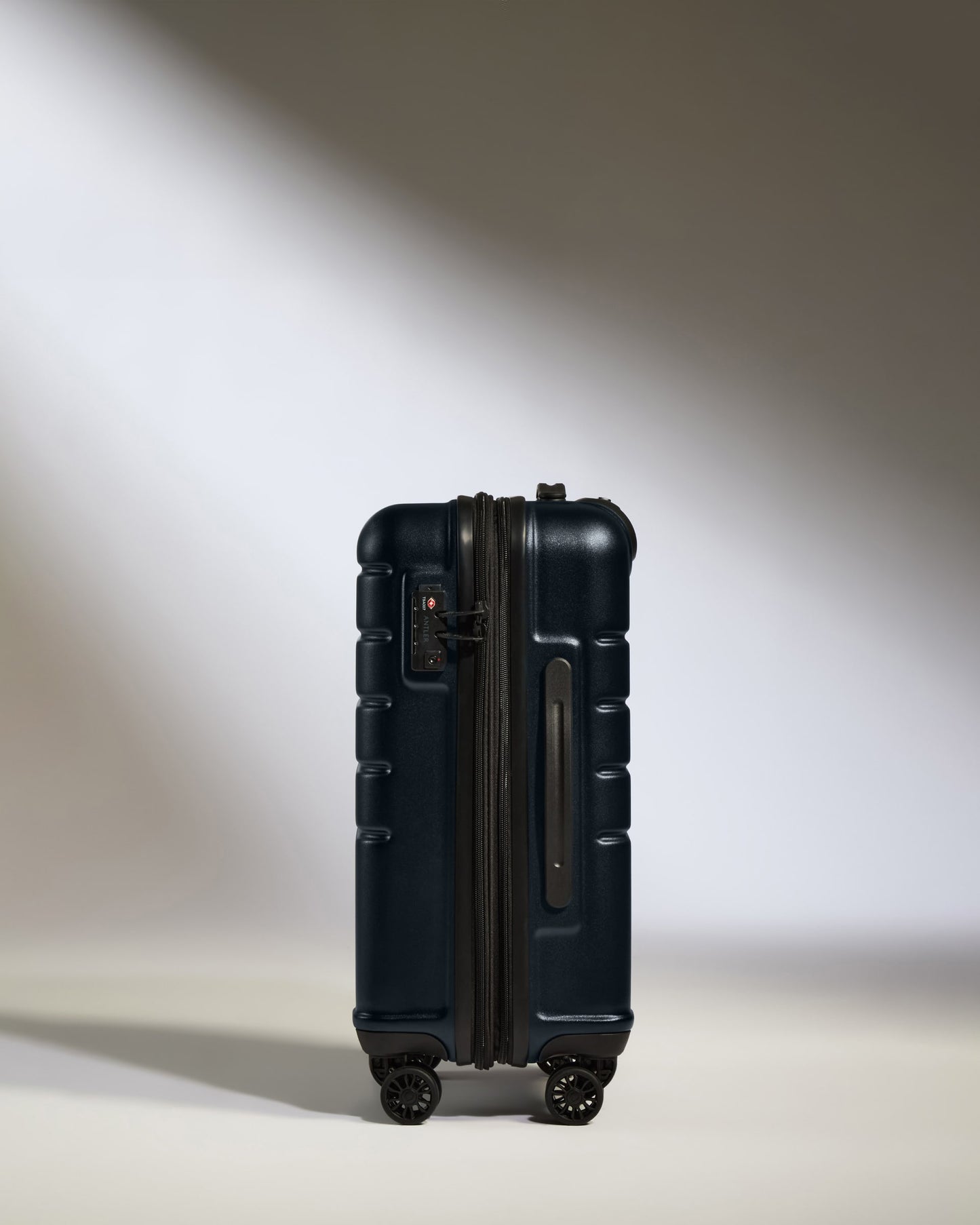 Cabin Suitcase in Dark Navy - Logo