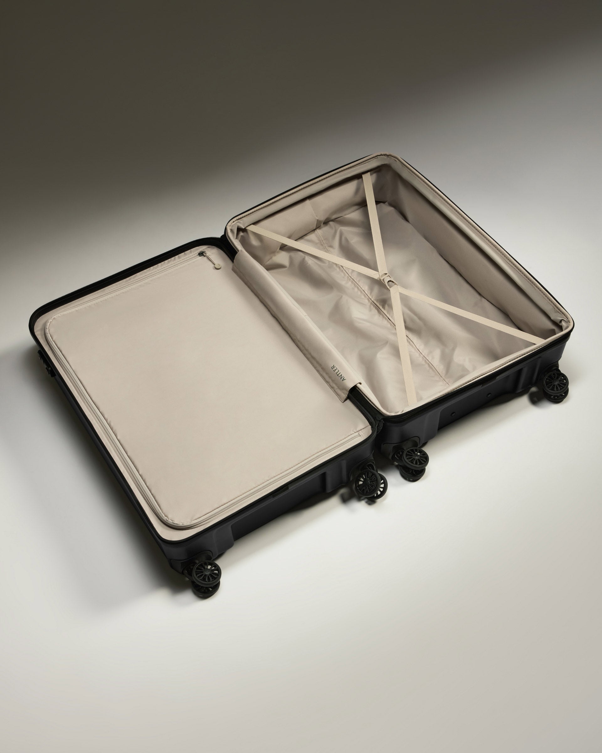 a suitcase with wheels and a lid