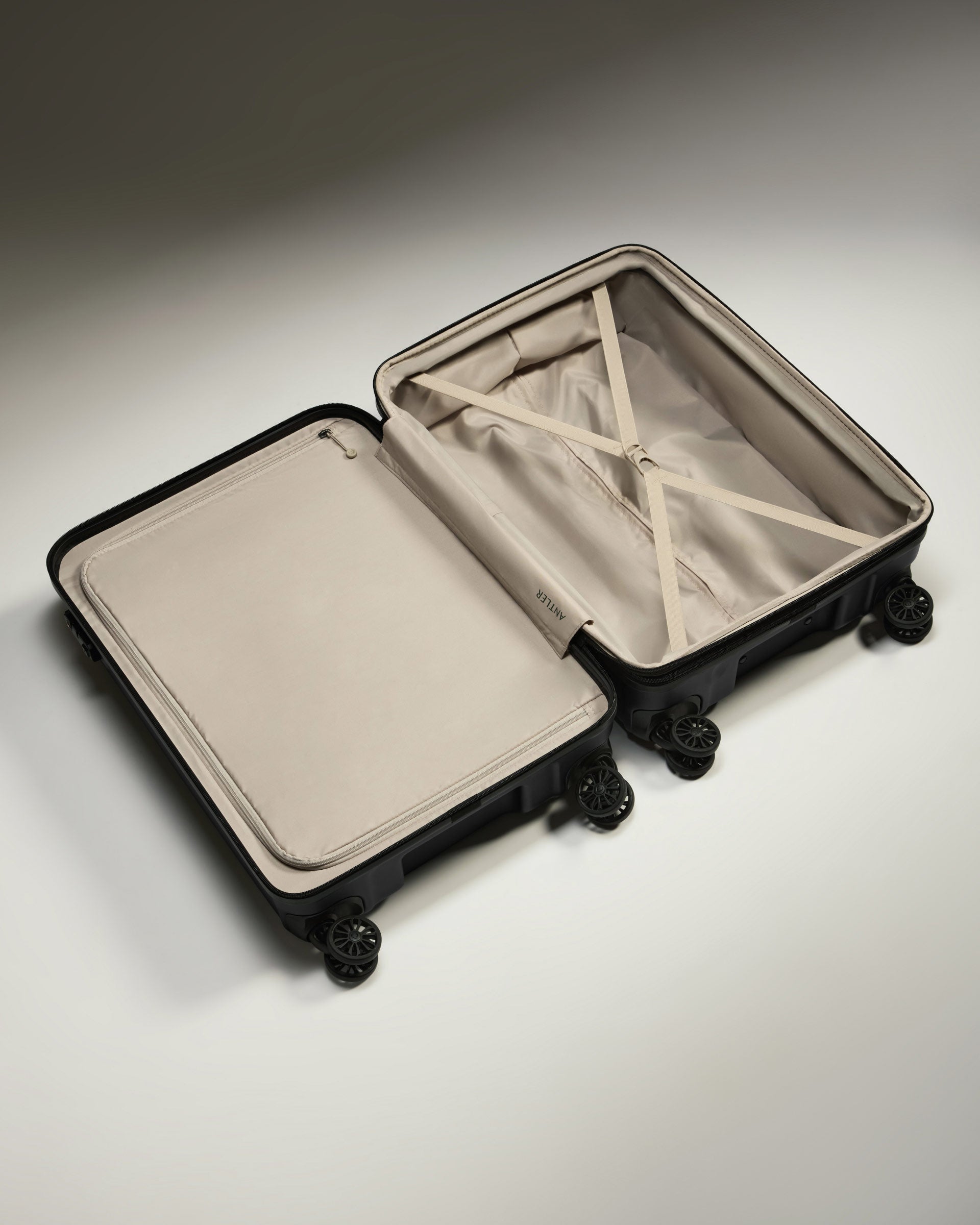 a suitcase with wheels and a white cover