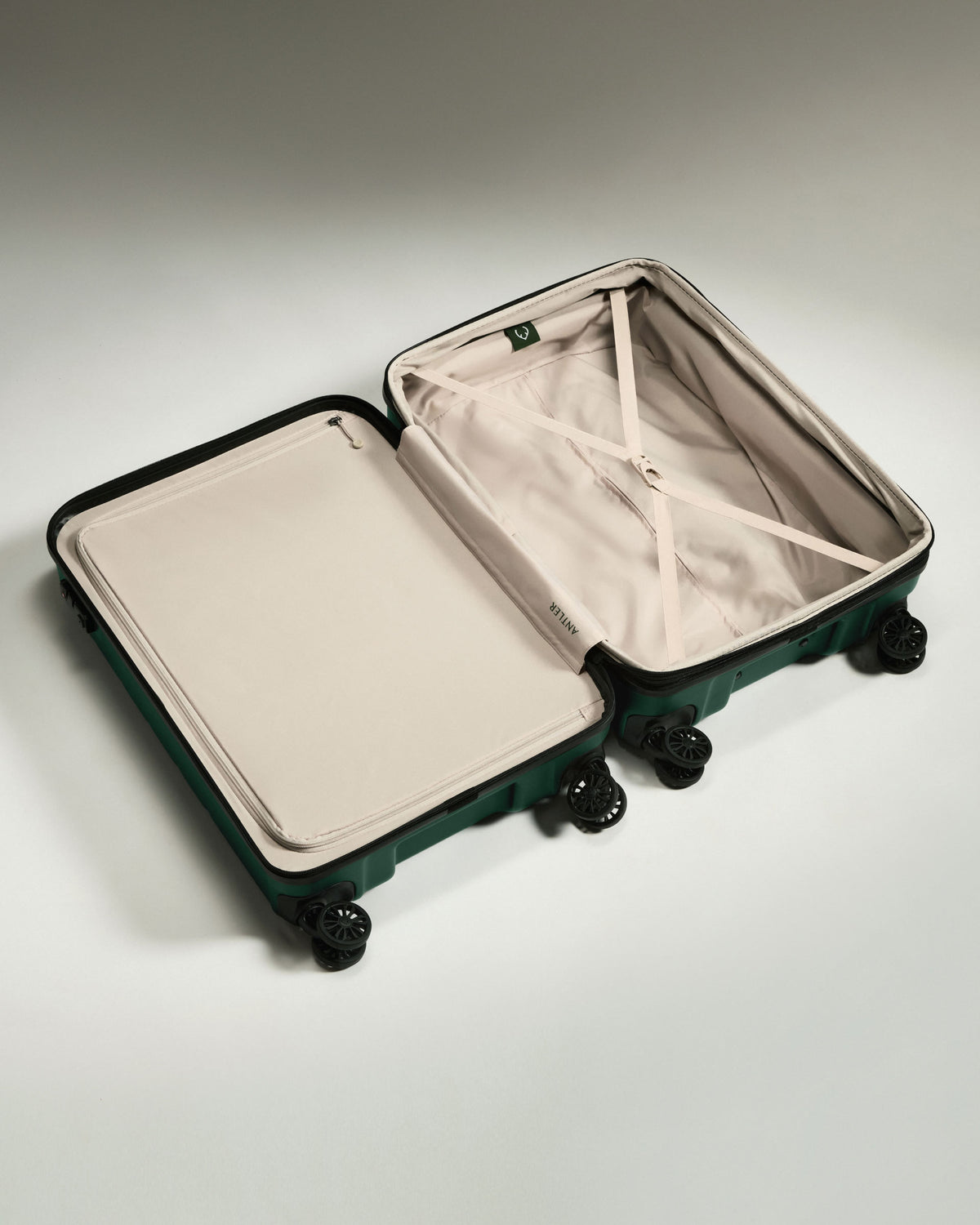 a suitcase with wheels and a white cover