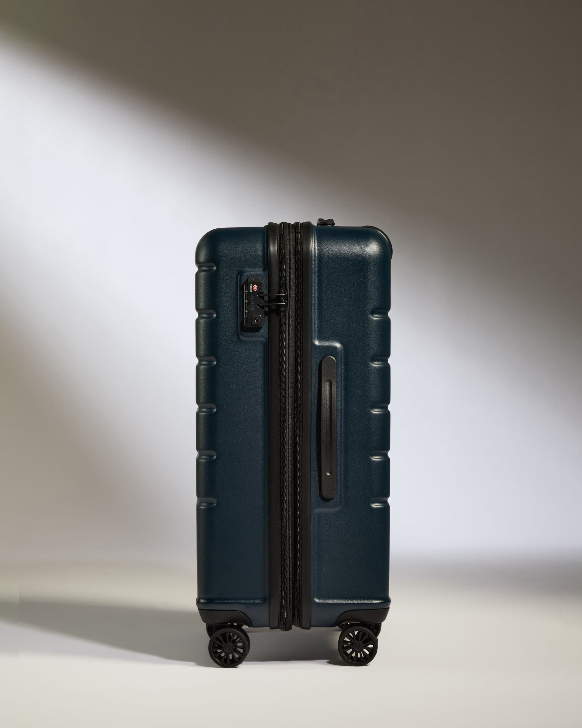 a blue suitcase with wheels