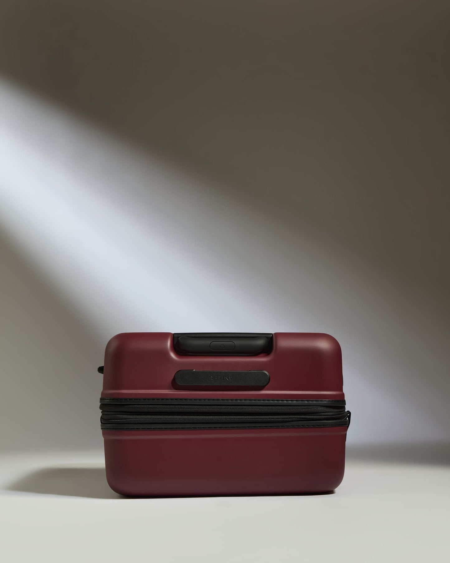 Medium Suitcase in Cedar Red - Icon Stripe