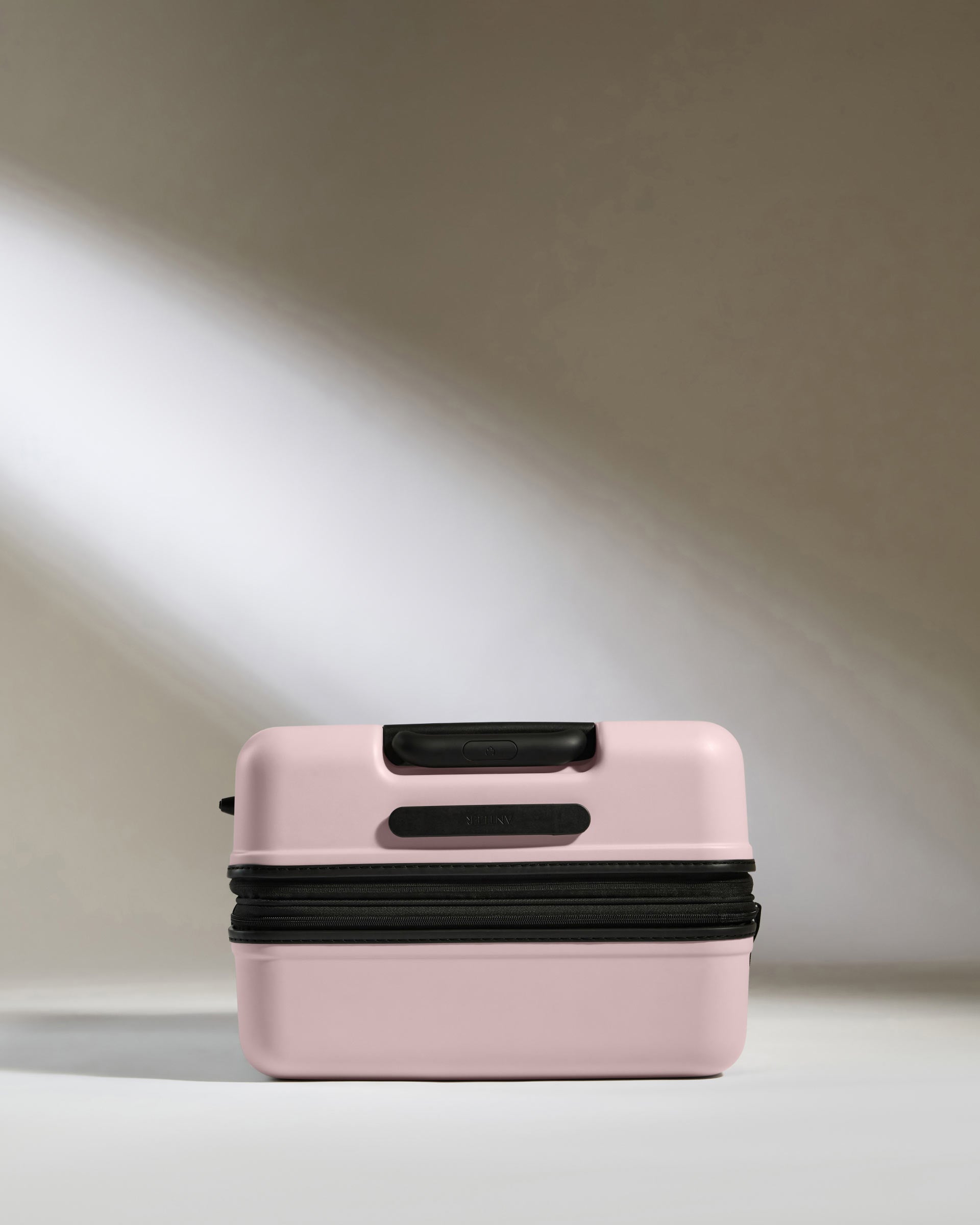 Medium suitcase in Moorland Pink Icon Stripe Lightweight Hard Shell Suitcase Antler Global