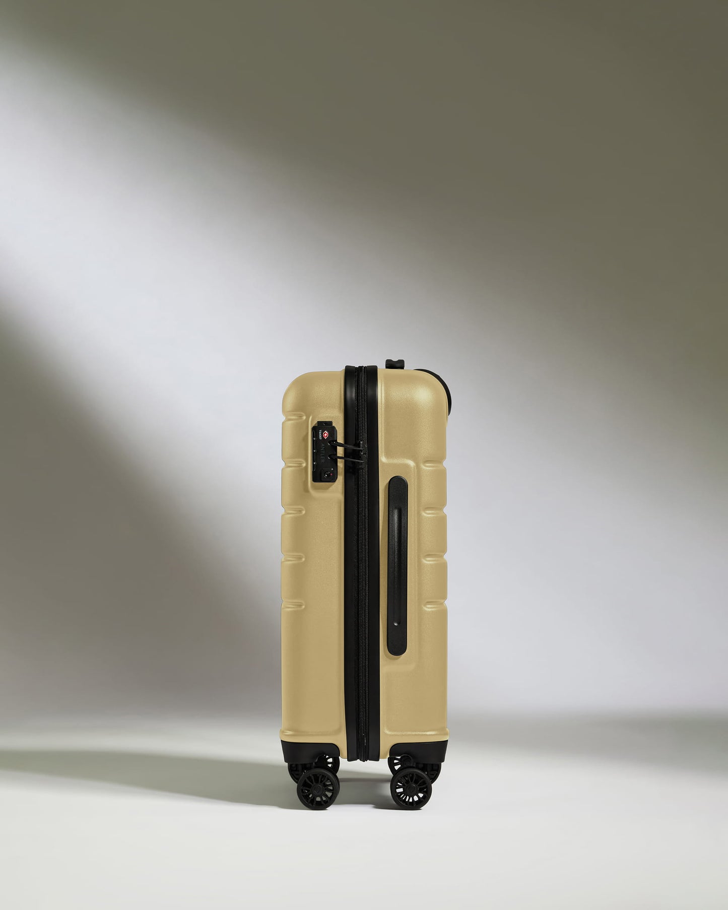 Cabin Suitcase in Dark Sand - Logo