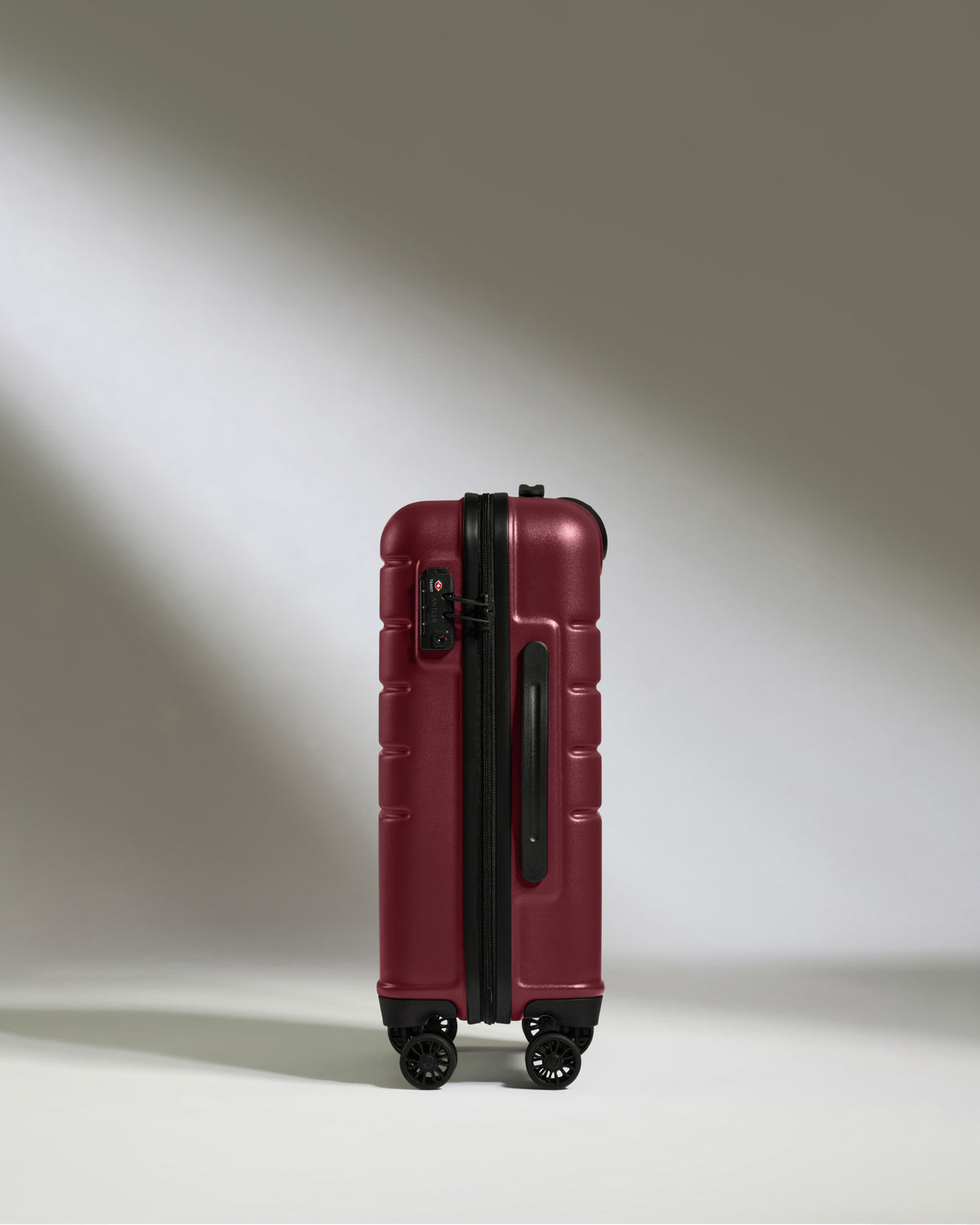 a red suitcase with wheels
