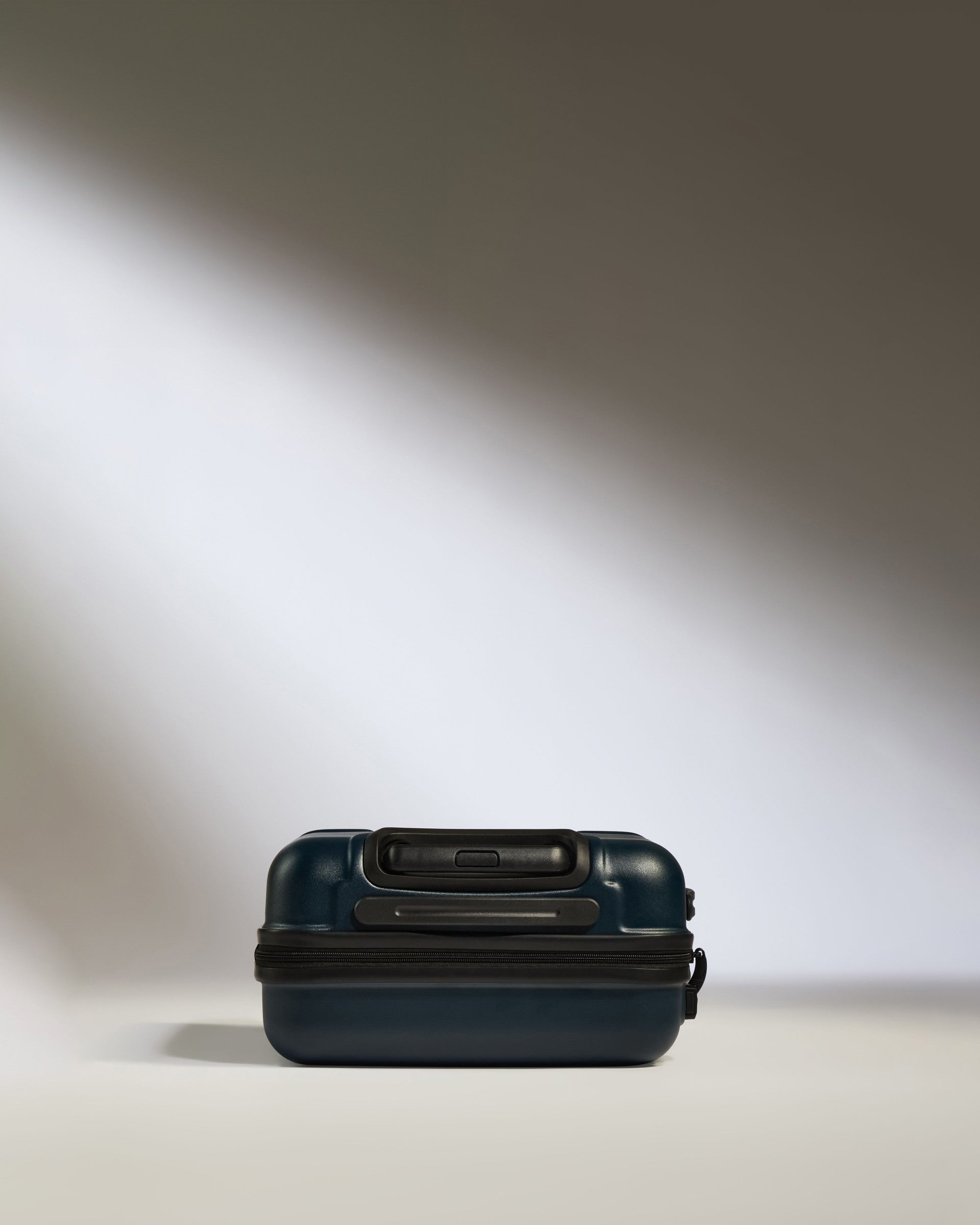 a blue suitcase with a zipper