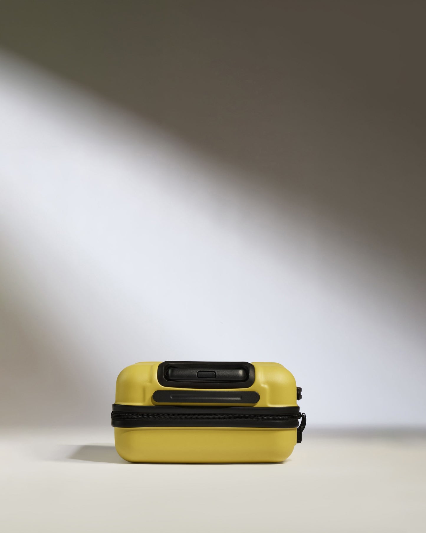 Cabin Suitcase in Mustard Yellow - Logo