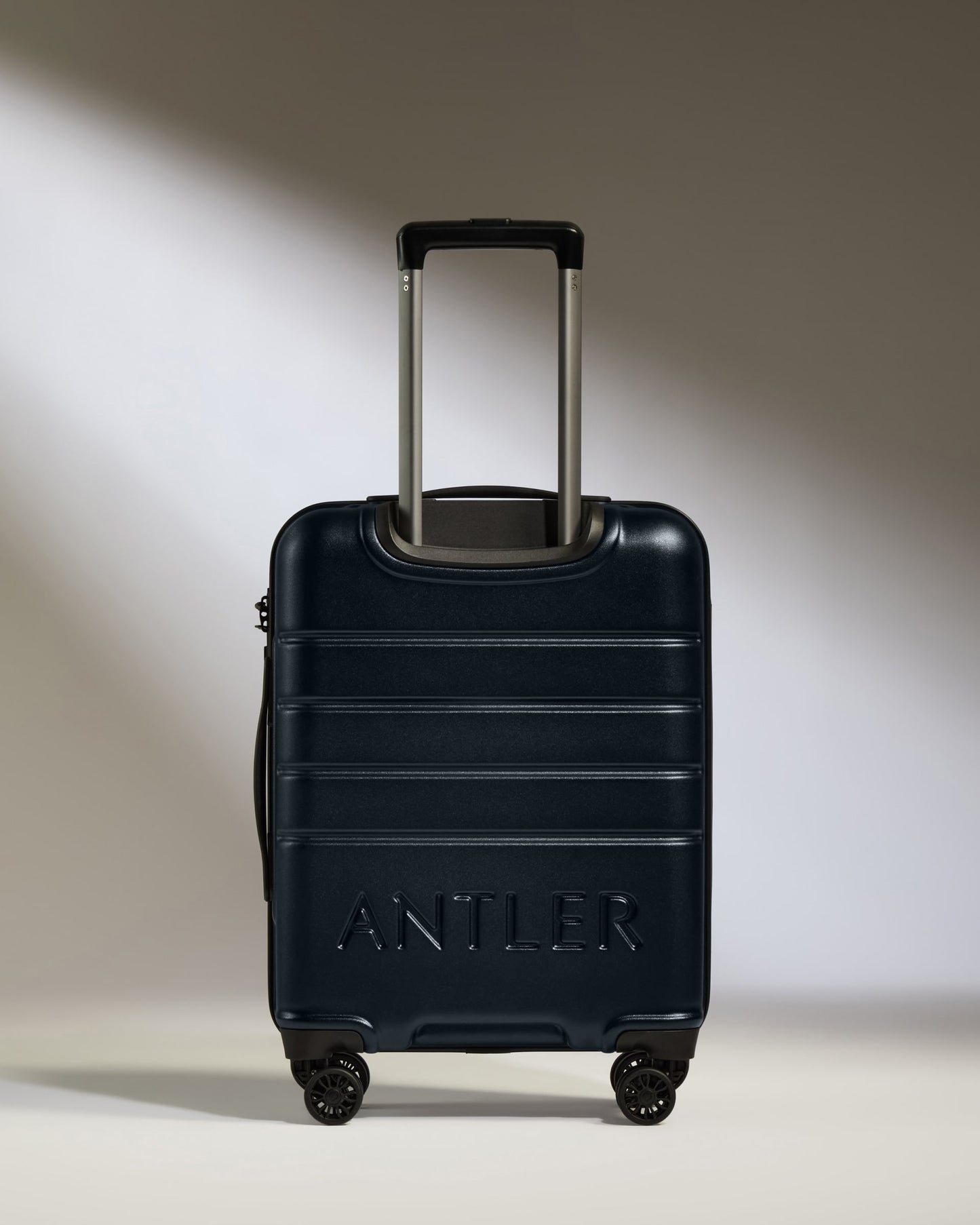 Cabin Suitcase in Dark Navy - Logo