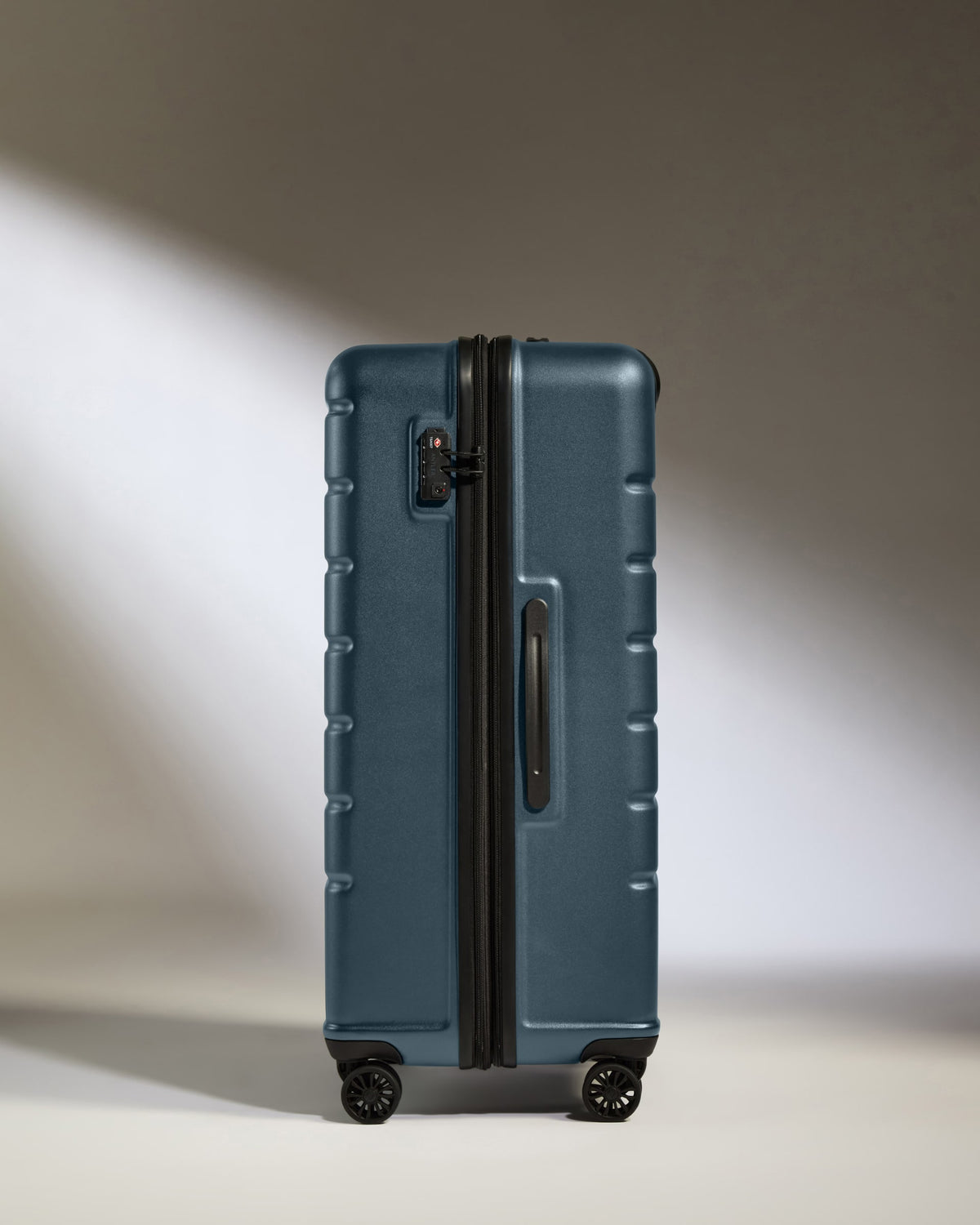 a blue suitcase with wheels
