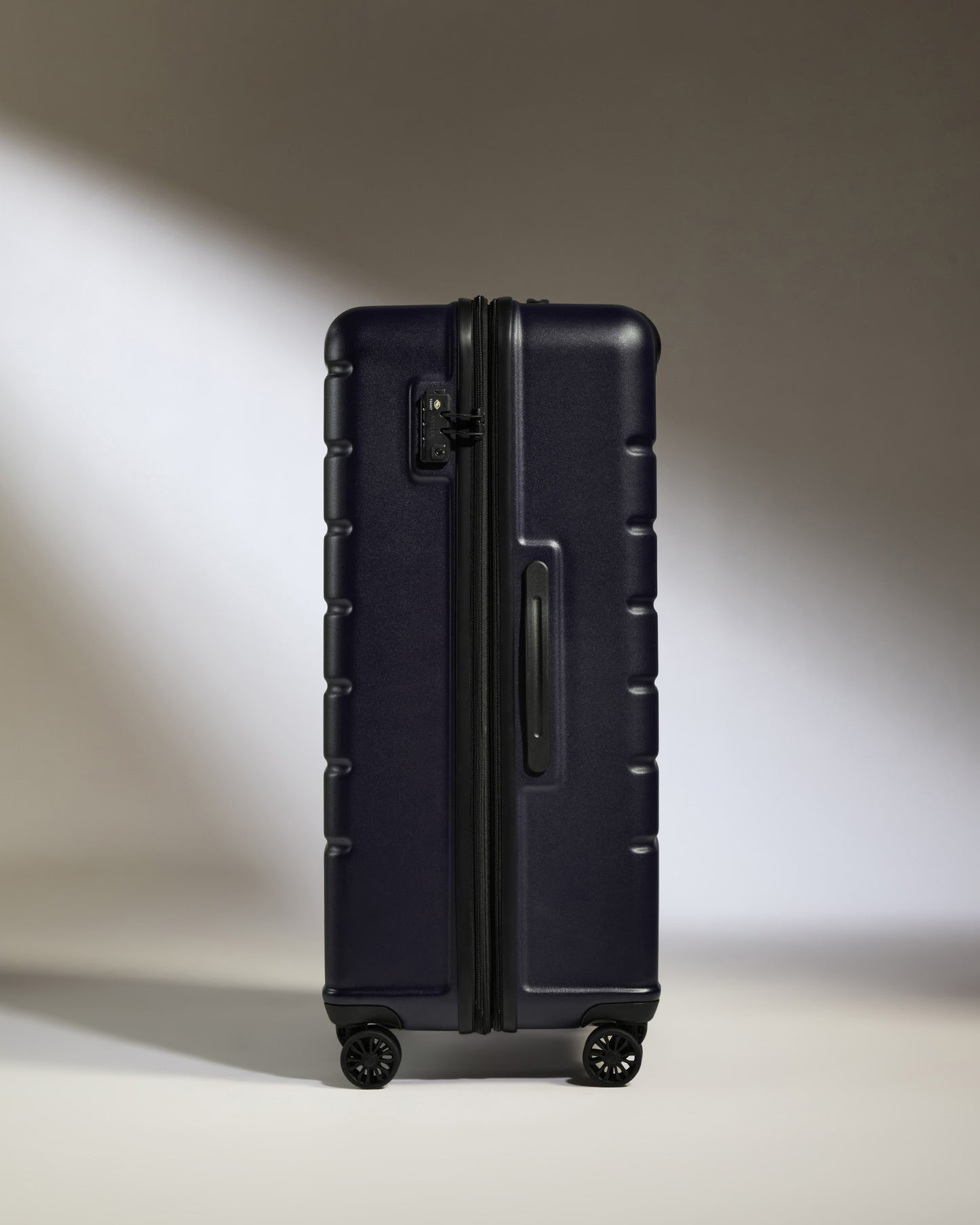 Large Suitcase in Dark Purple - Logo