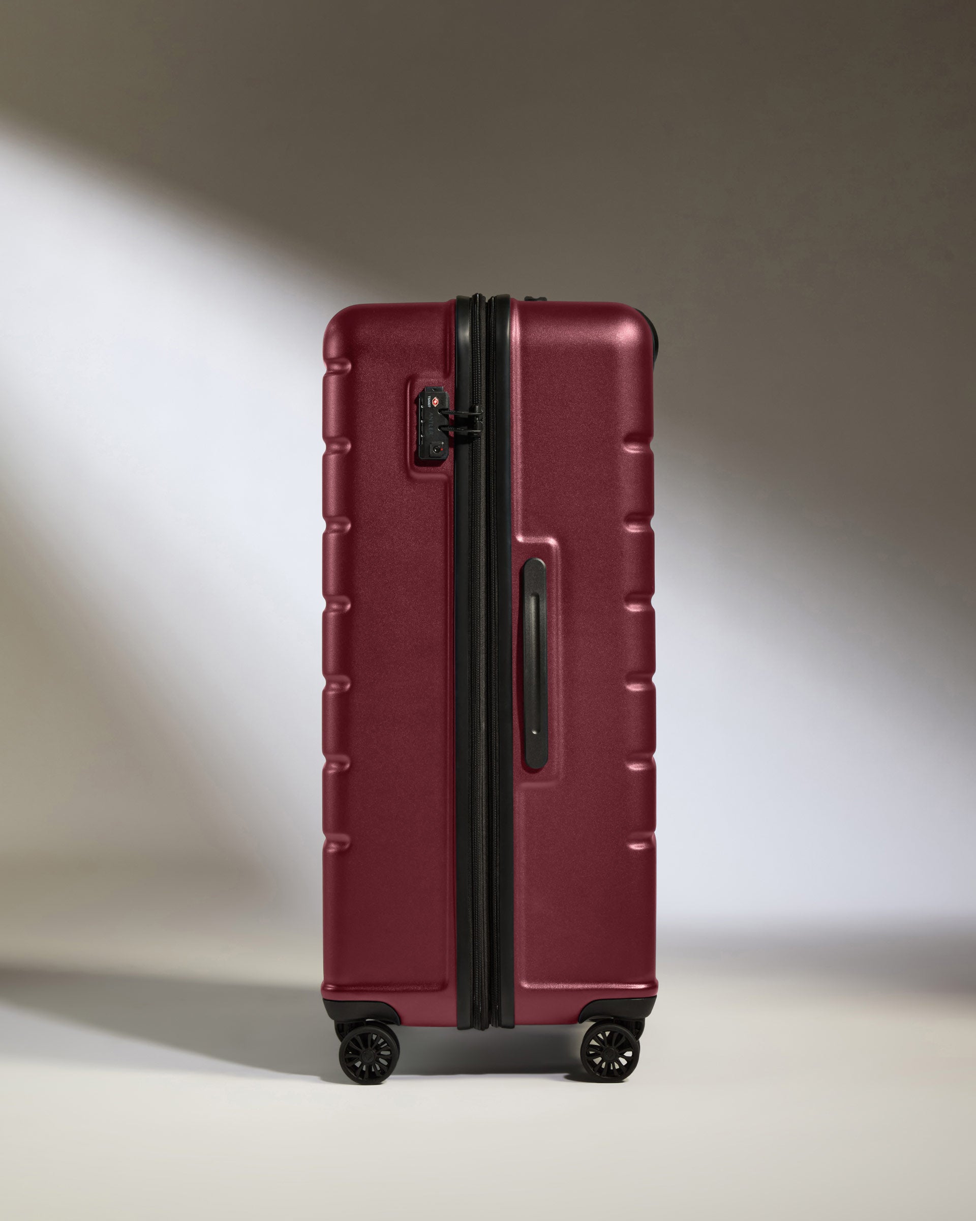 a red suitcase with wheels