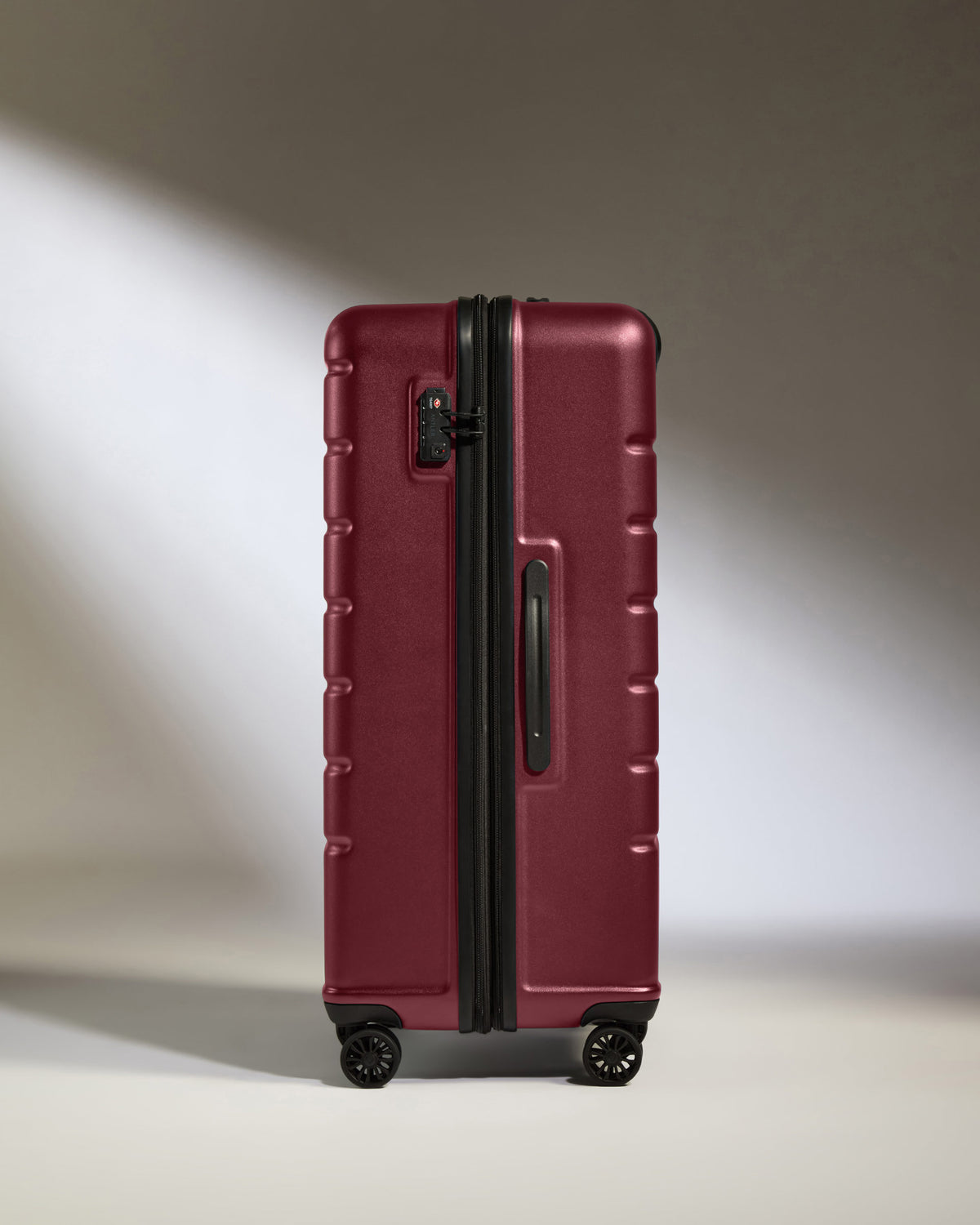 a red suitcase with wheels