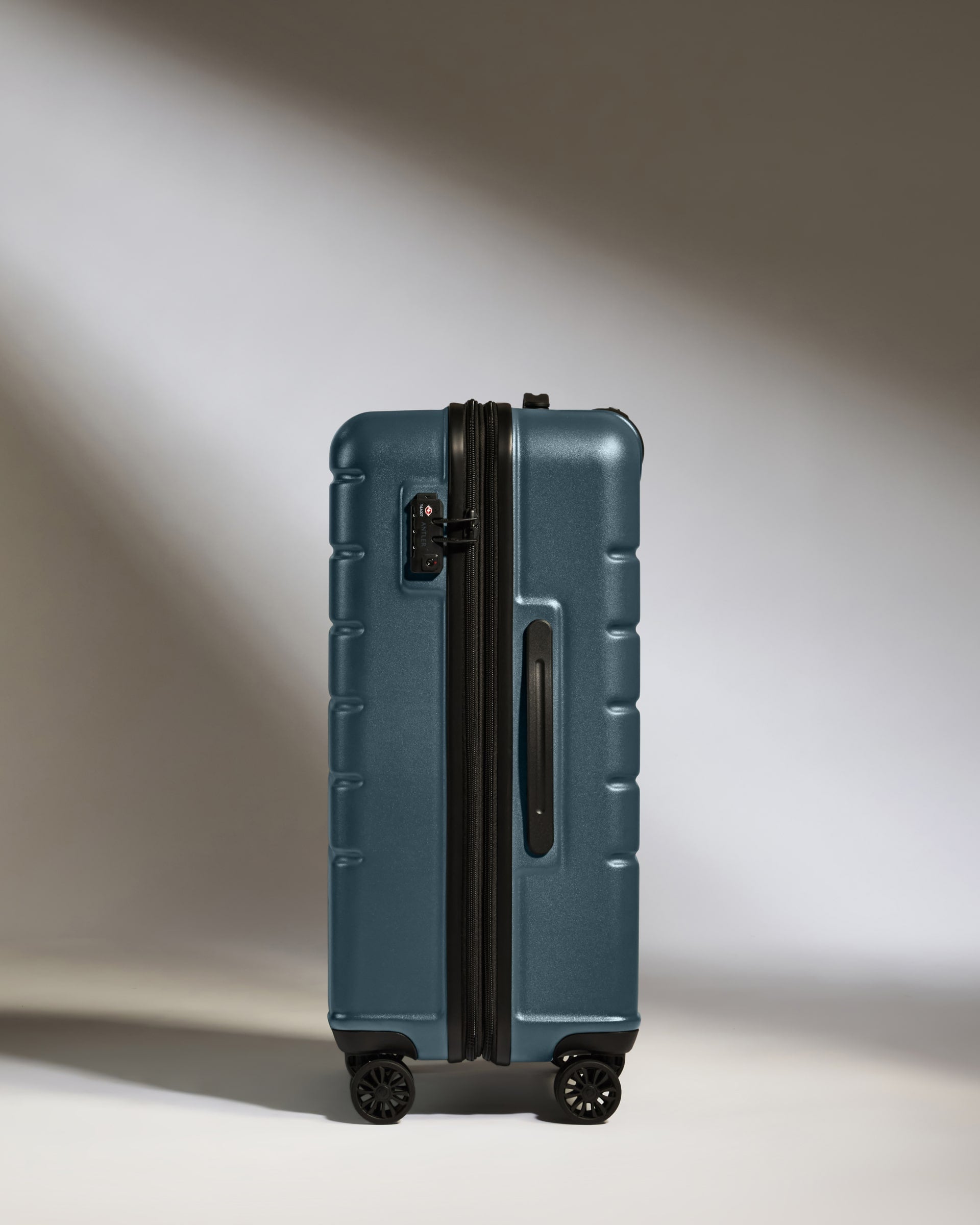 a blue suitcase with wheels