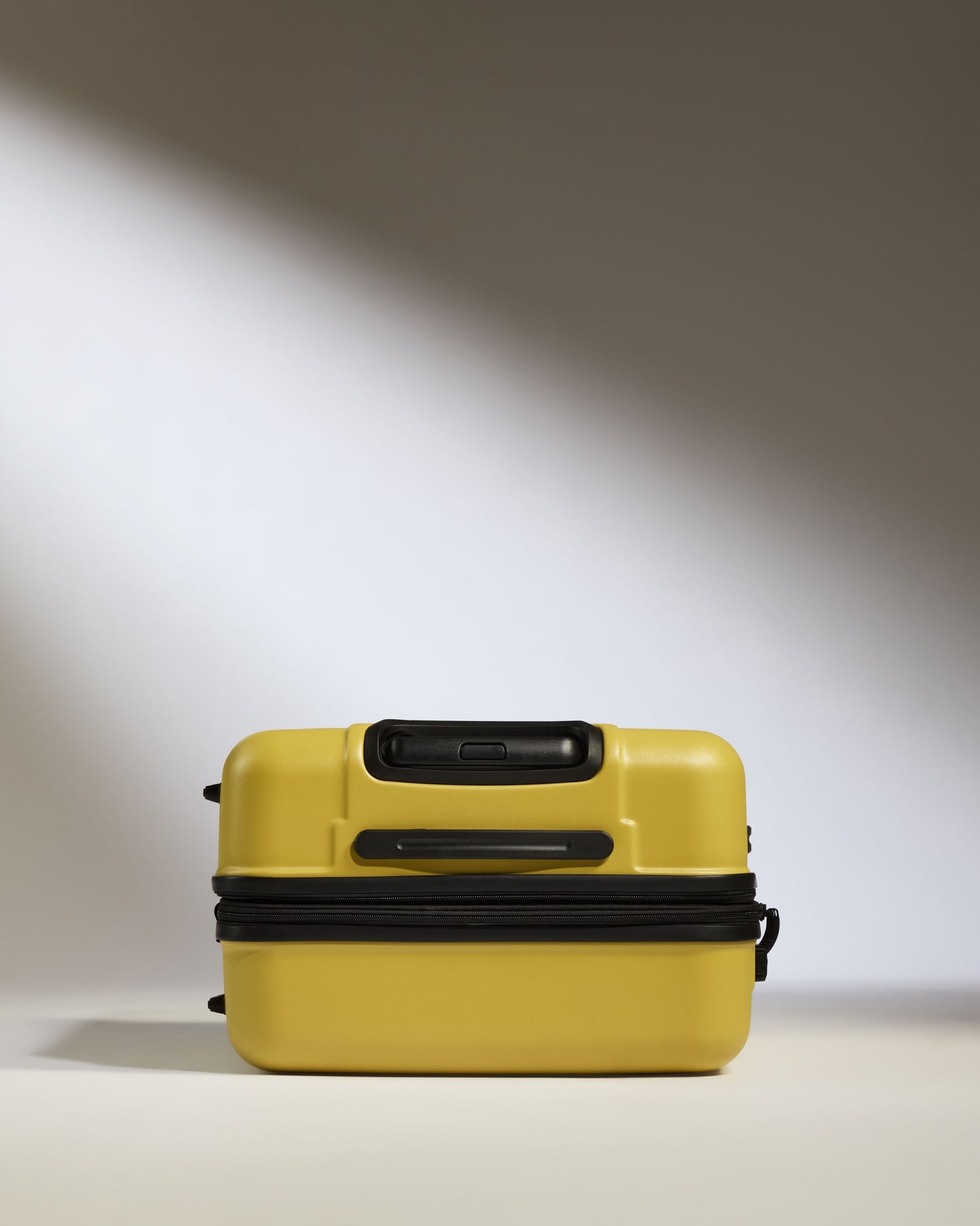 Medium Suitcase in Mustard Yellow - Logo