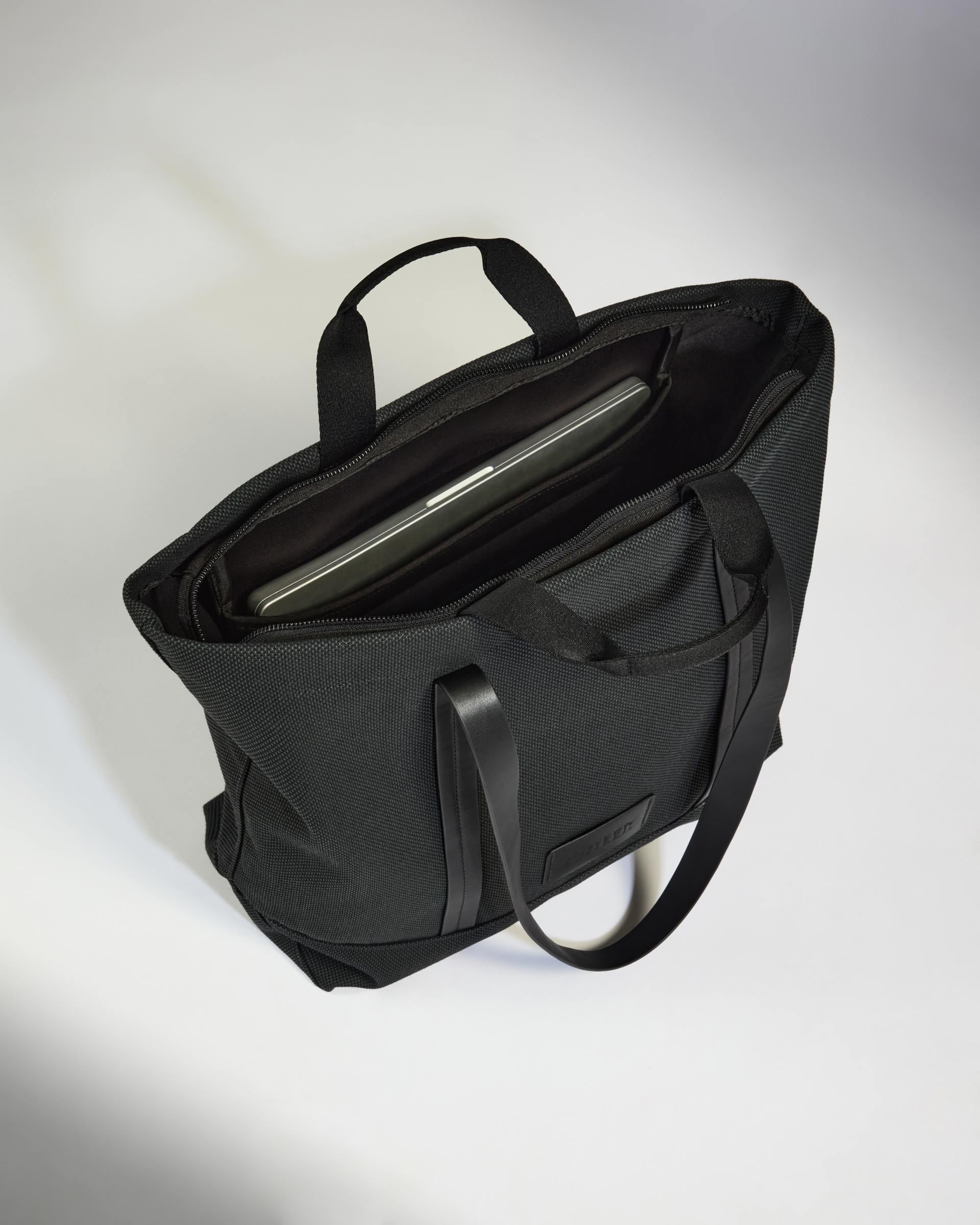 a black bag with a tablet inside