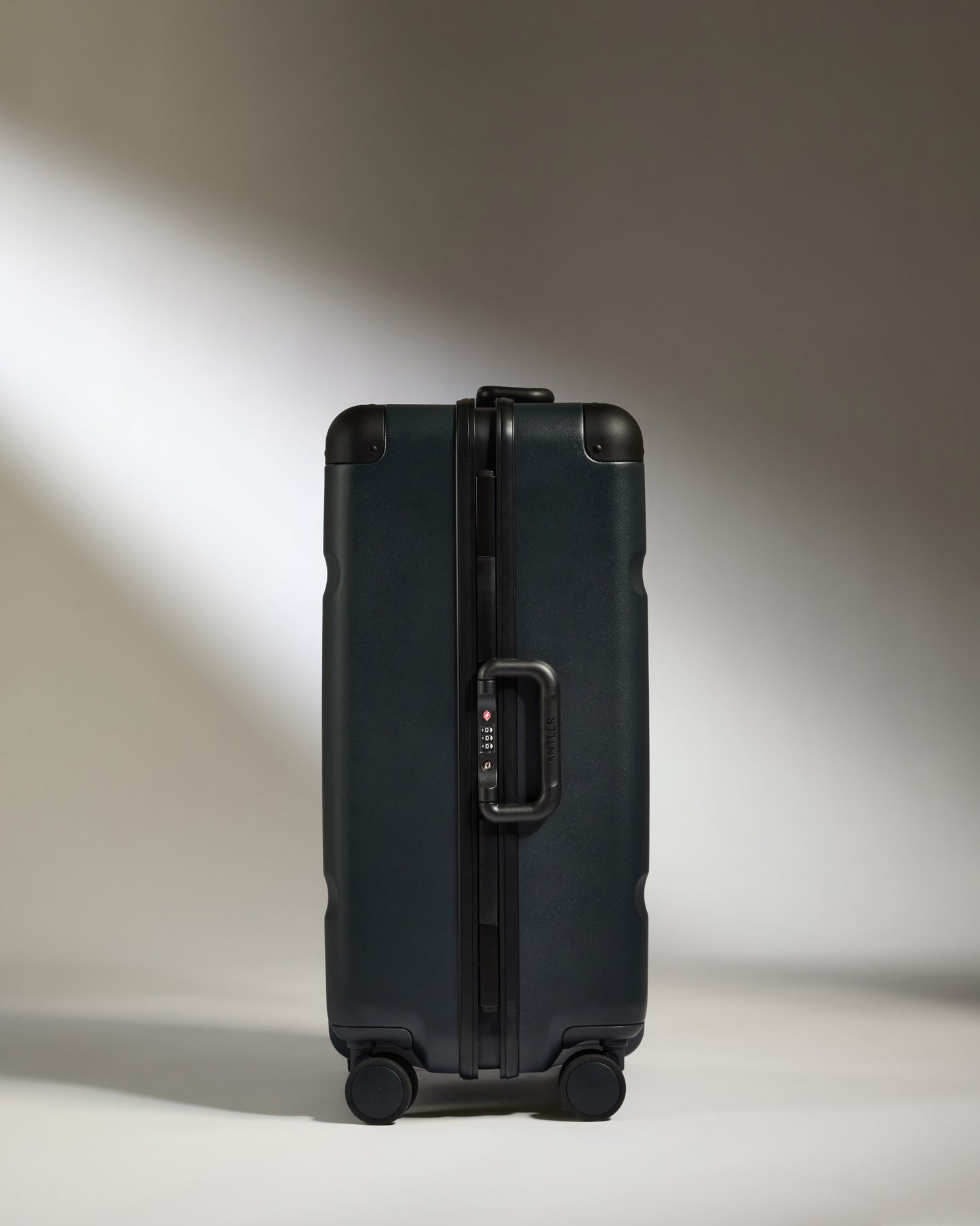 Medium Suitcase in Basalt Navy - Heritage Stripe