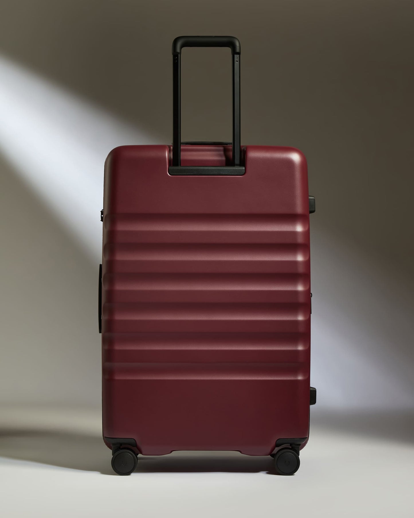 Large Suitcase in Cedar Red - Icon Stripe