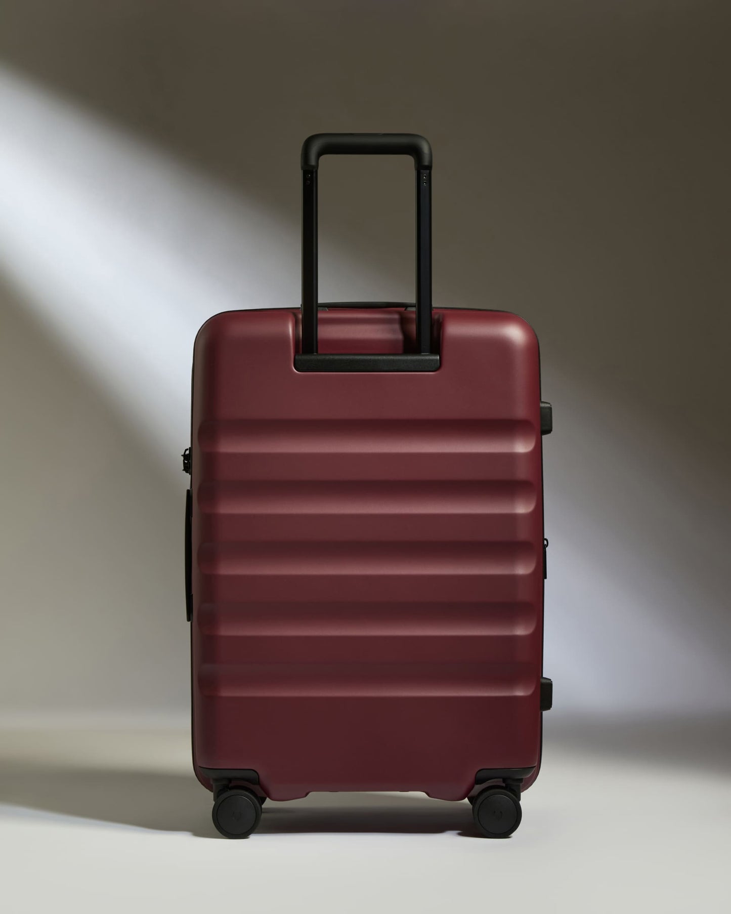 Medium Suitcase in Cedar Red - Icon Stripe