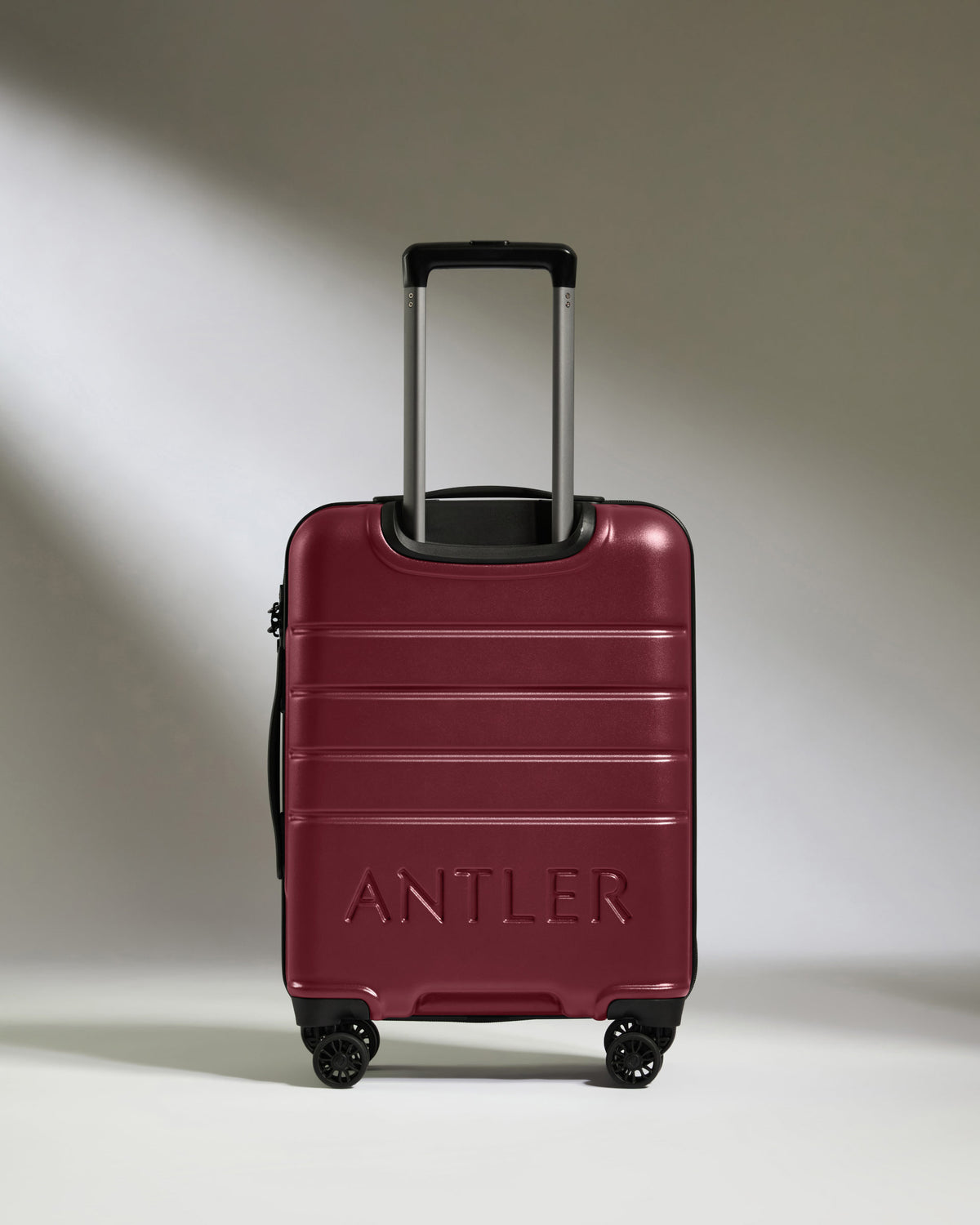 a red suitcase with handle